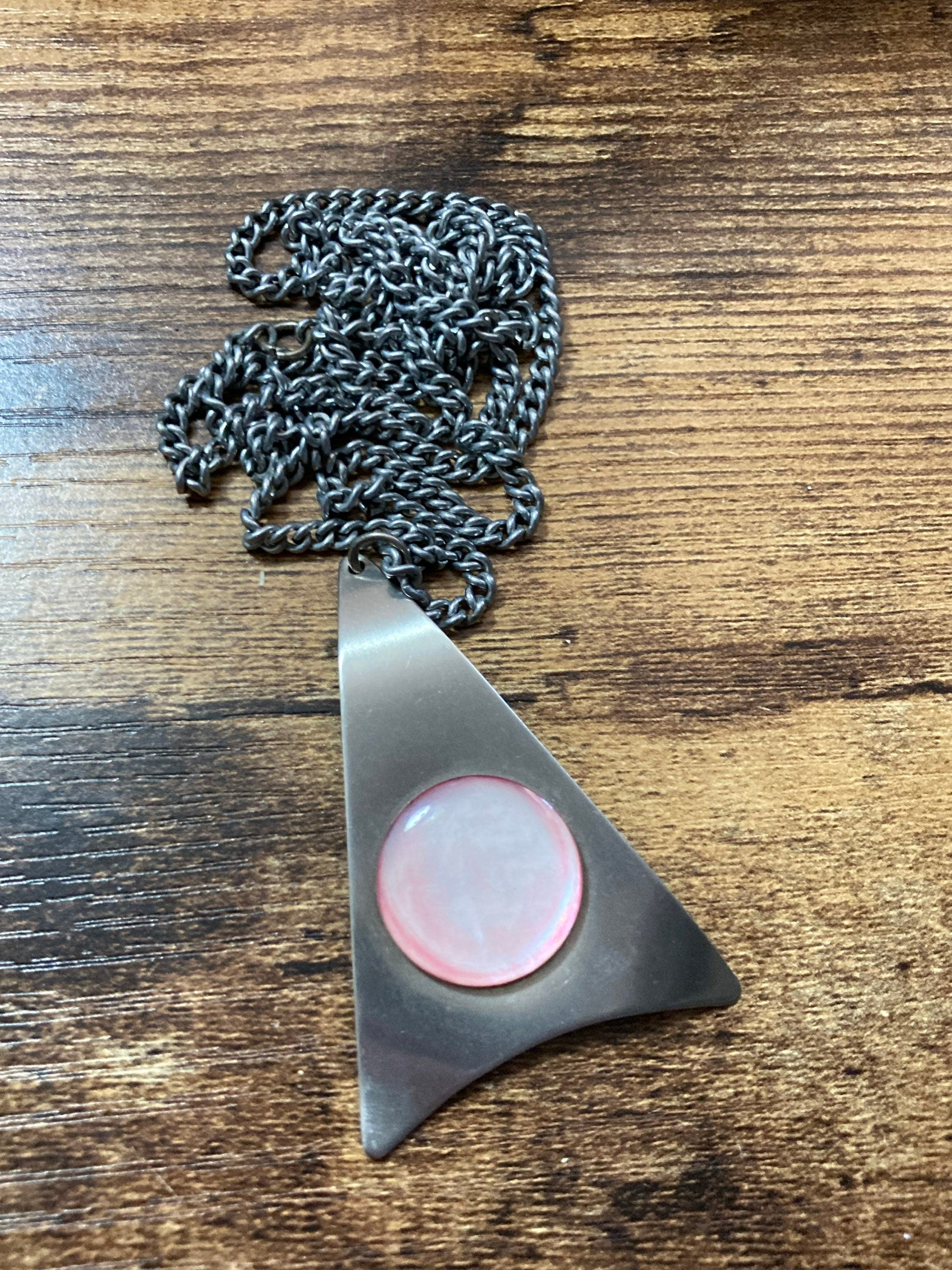 Vintage Modernist stainless steel pendant necklace with central pale pink cabochon