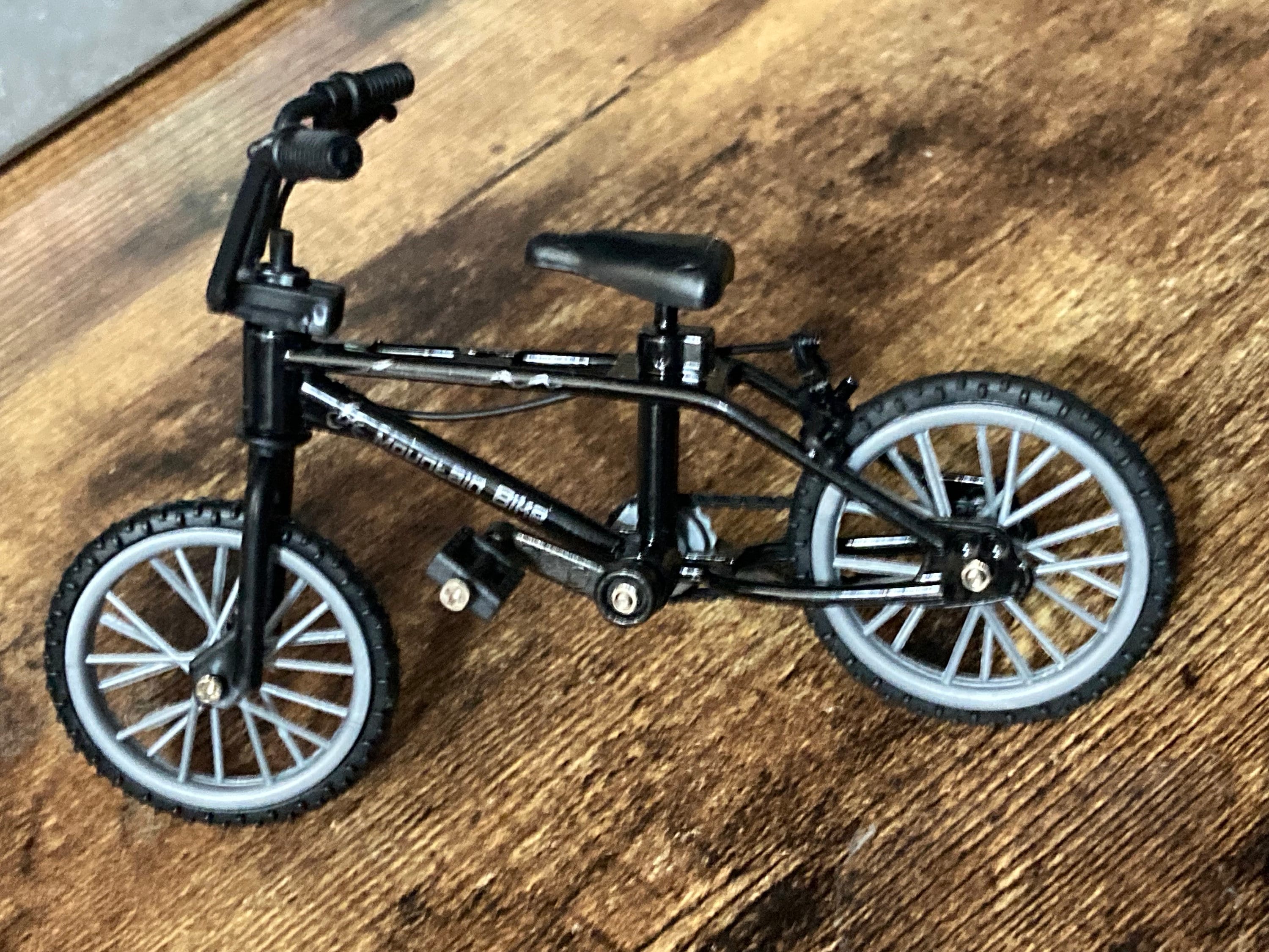 Miniature plastic black mountain bike BMX cake topper decoration