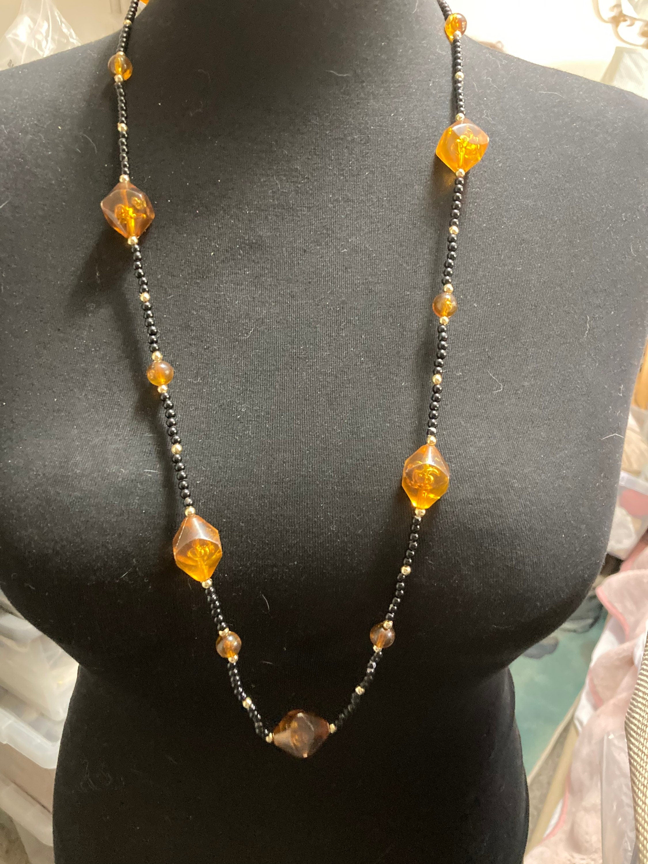 Long faux amber plastic beaded necklace with black gold seed beads 95cm