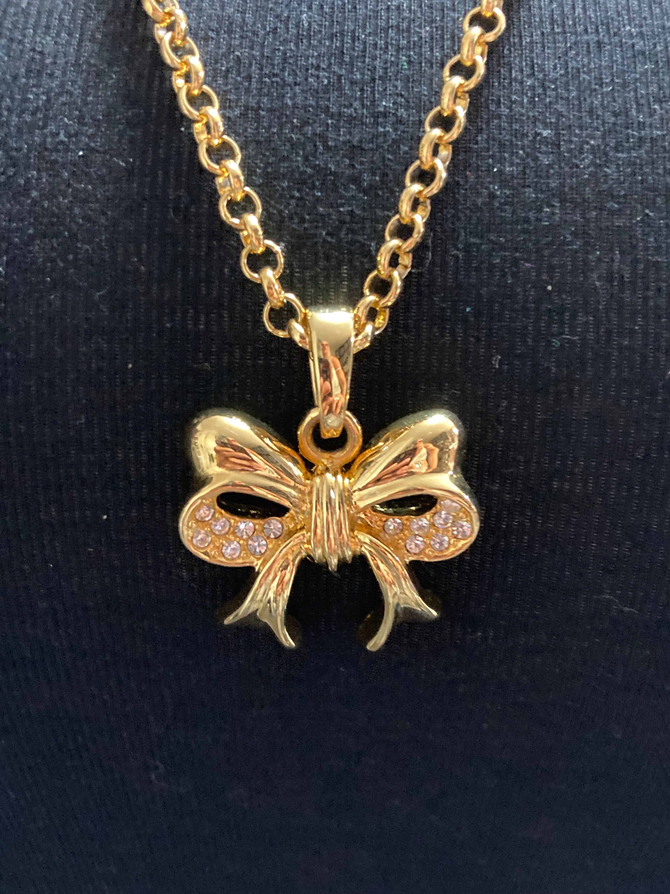 Signed Joan Rivers gold plated clear diamanté bow pendant necklace