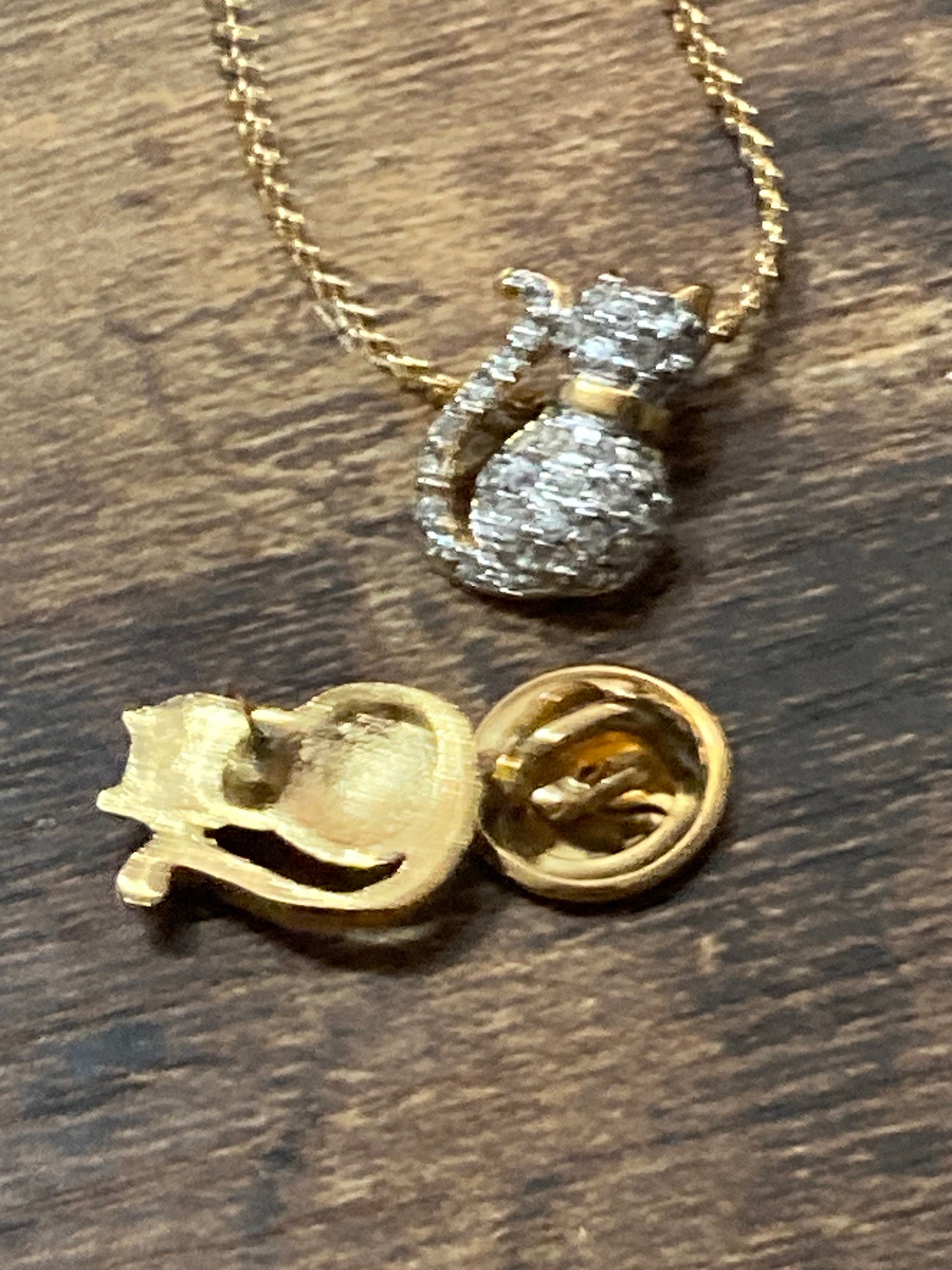 Retro diamanté cat pendant on a gold plated 44cm serpentine chain and matching pin brooch