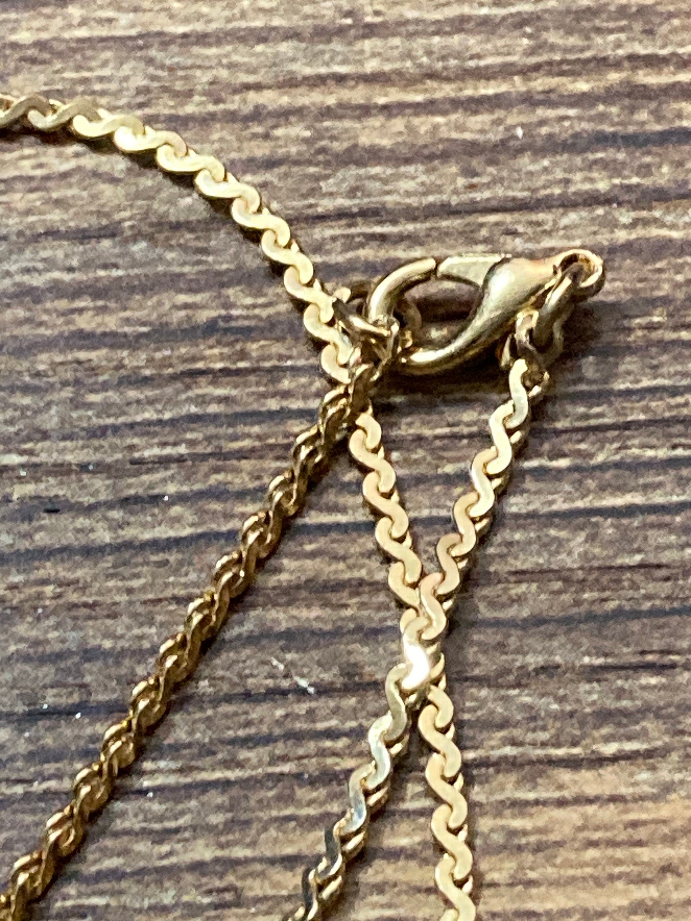 Retro diamanté cat pendant on a gold plated 44cm serpentine chain and matching pin brooch