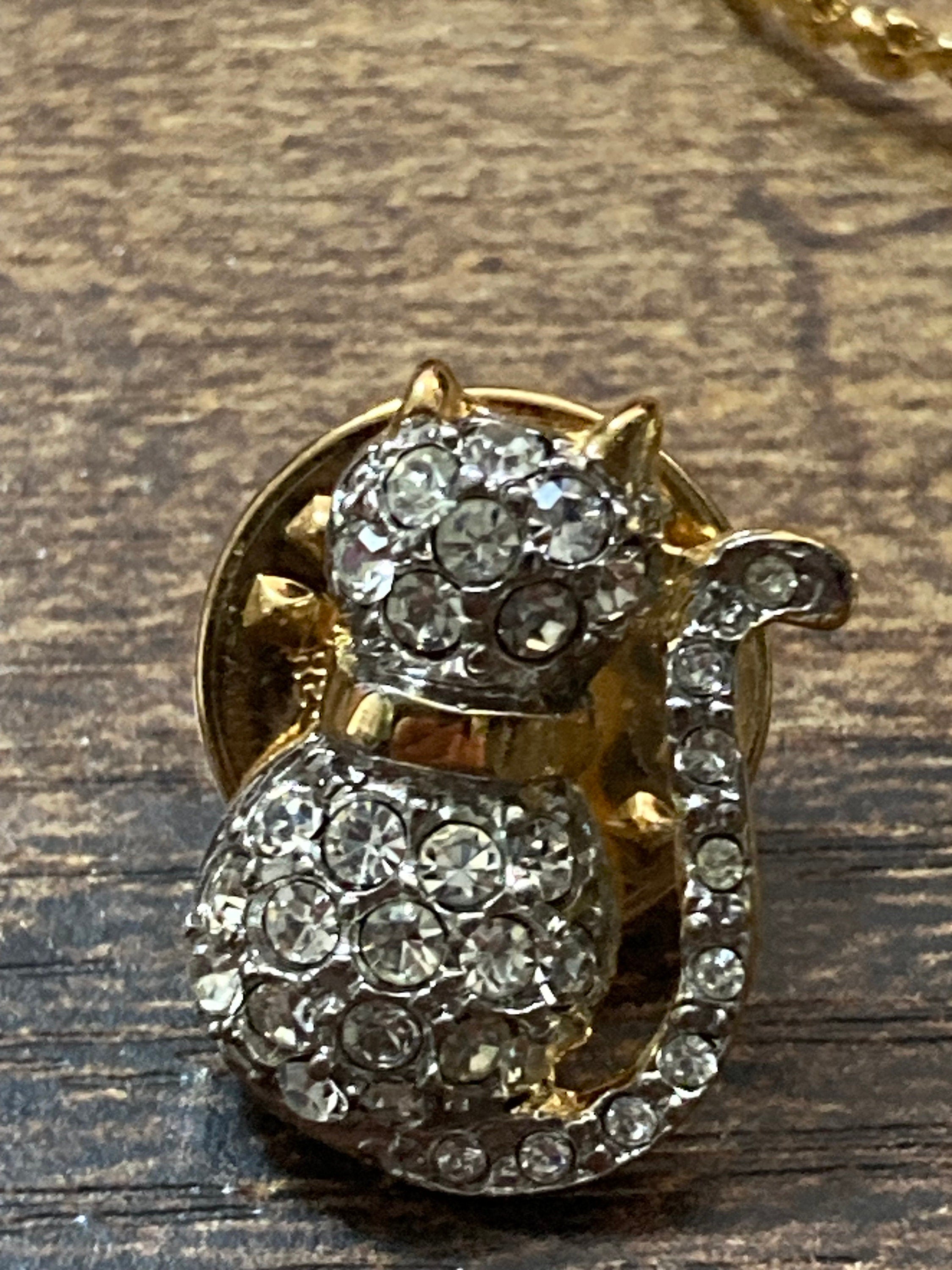 Retro diamanté cat pendant on a gold plated 44cm serpentine chain and matching pin brooch