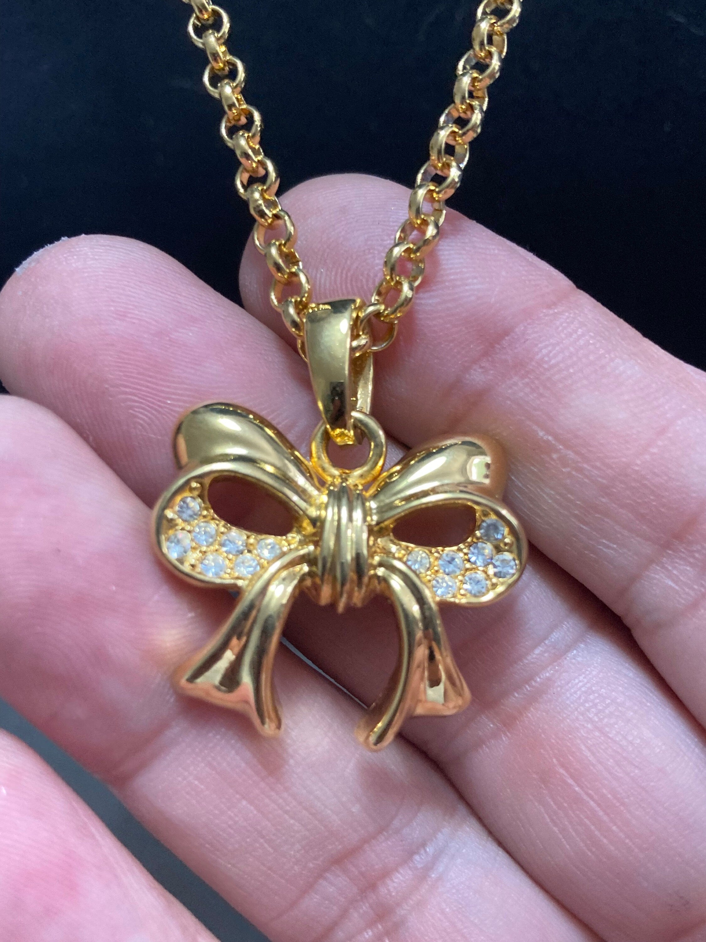 Signed Joan Rivers gold plated clear diamanté bow pendant necklace