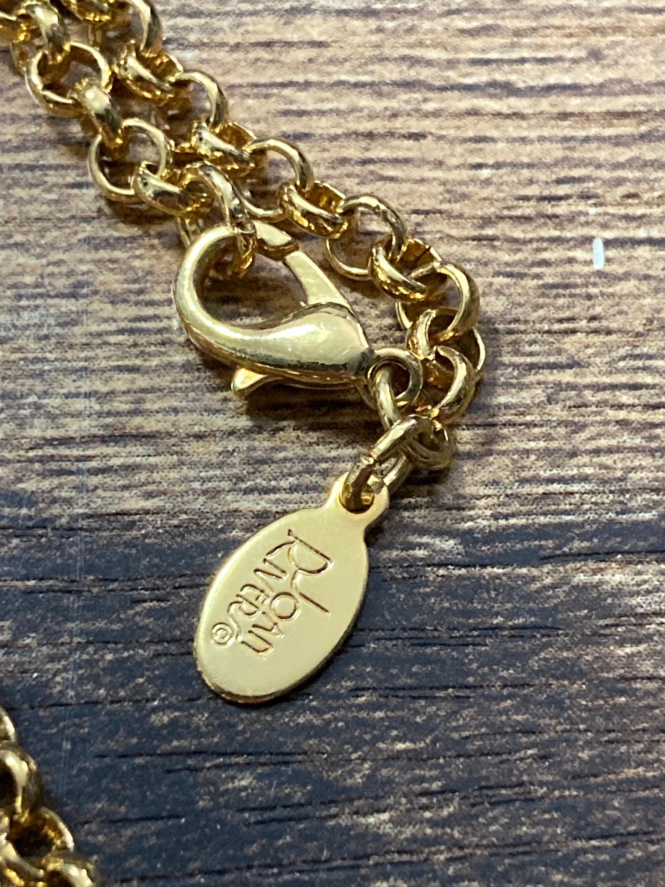 Signed Joan Rivers gold plated clear diamanté bow pendant necklace