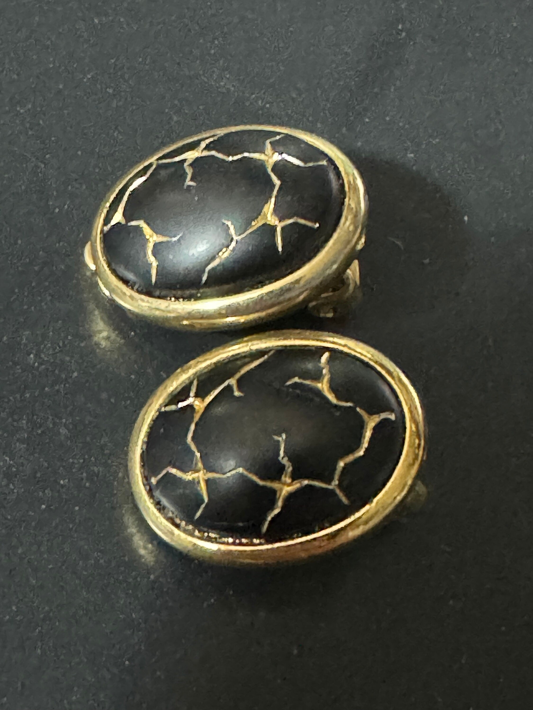 Gold tone gold black enamel Crackle glaze clip on earrings