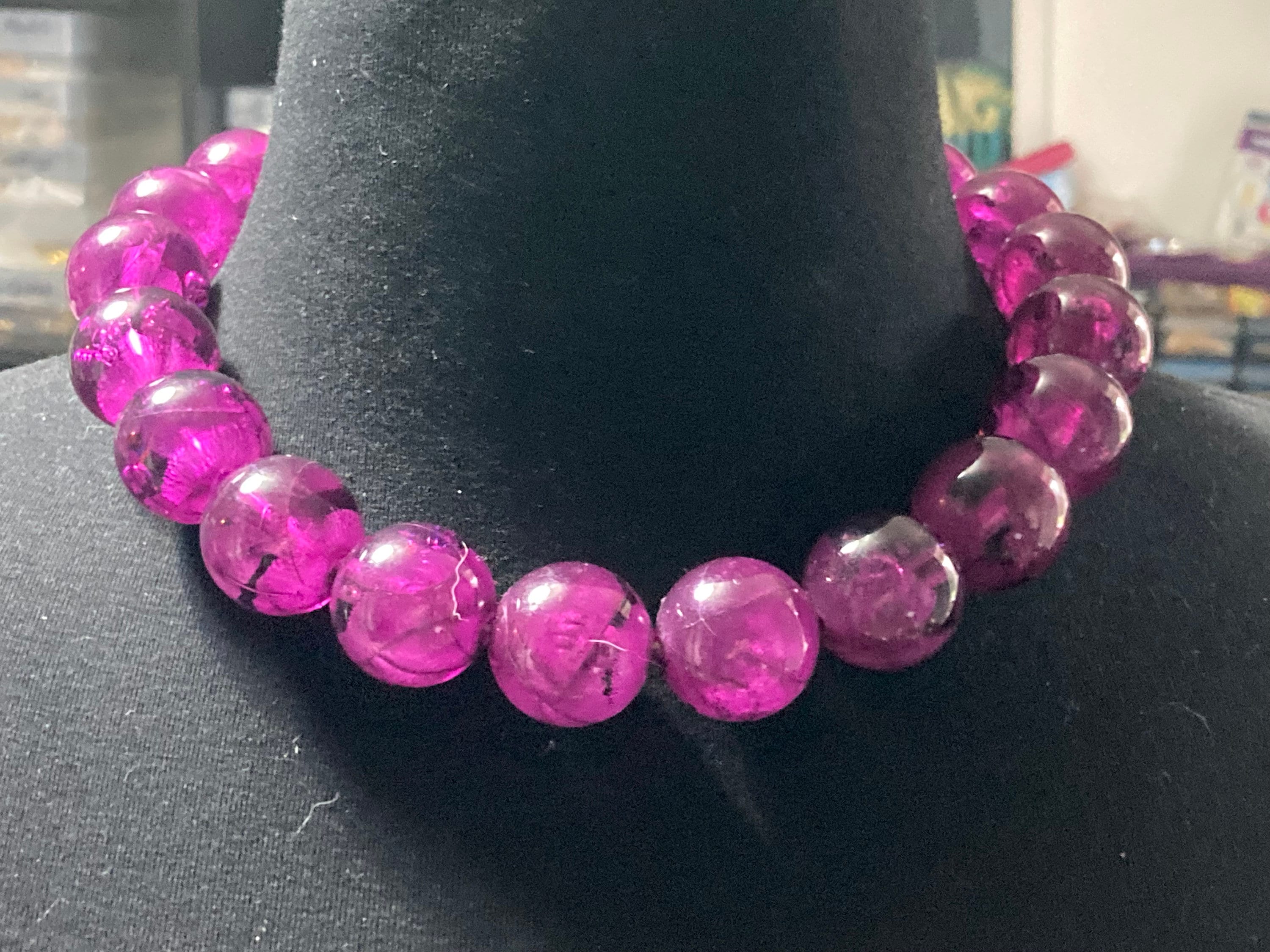 Oversized plastic beaded necklace purple tones