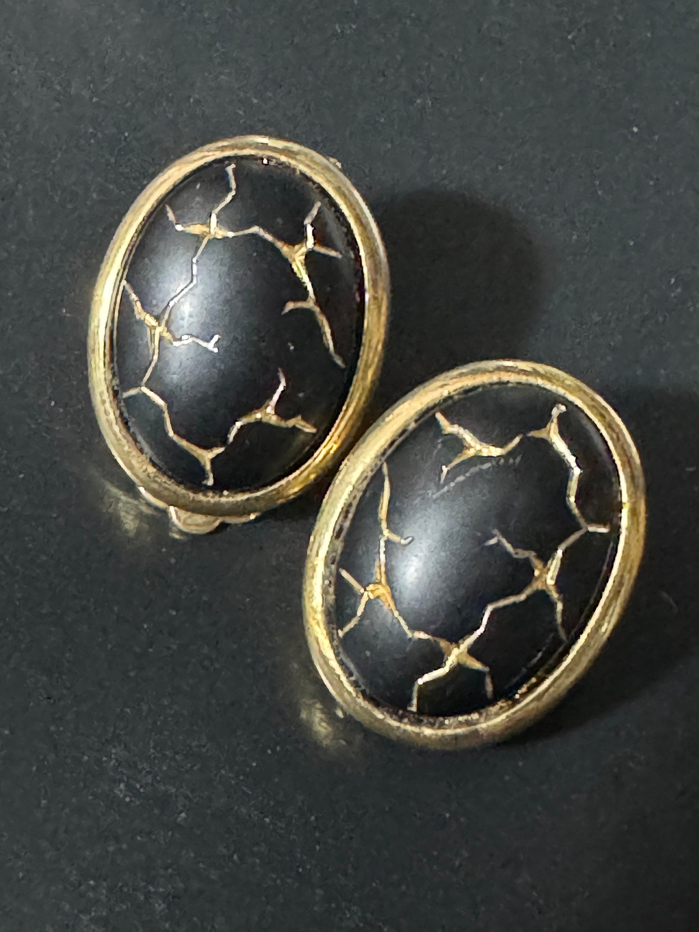 Gold tone gold black enamel Crackle glaze clip on earrings