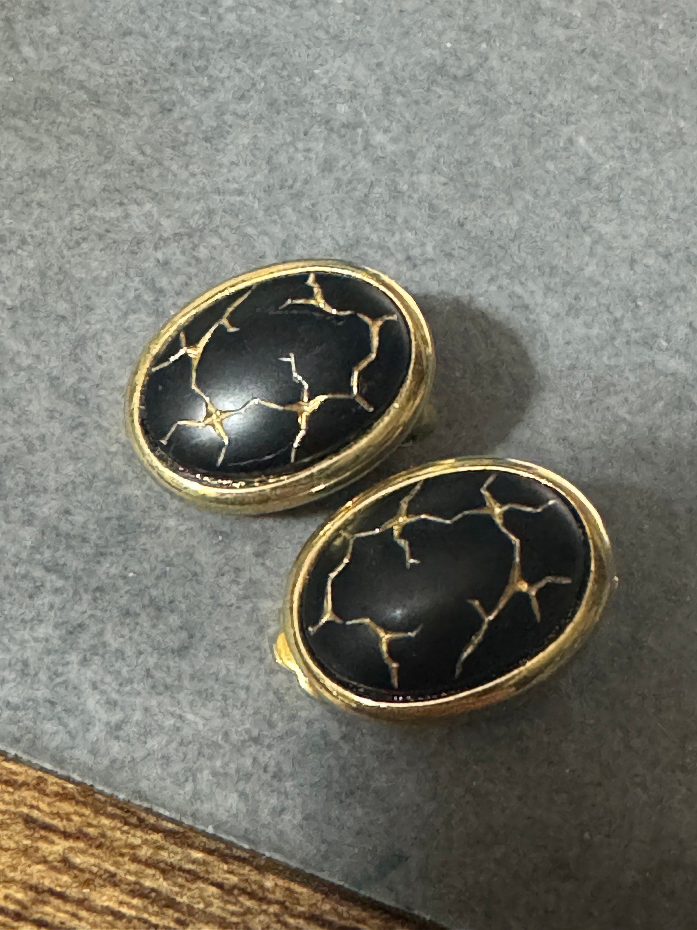 Gold tone gold black enamel Crackle glaze clip on earrings