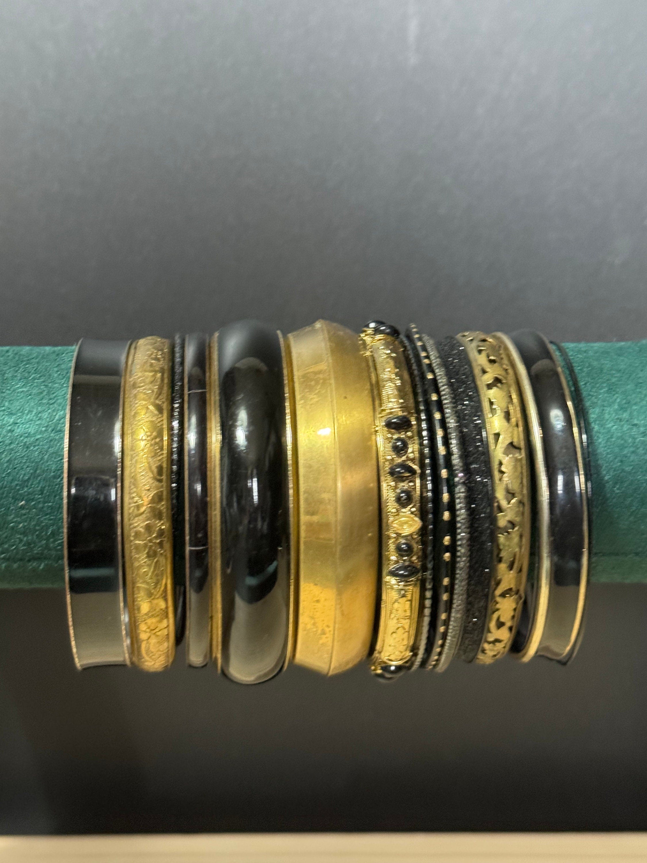 Armful of vintage black and gold tones slim and wide tacking boho bangles