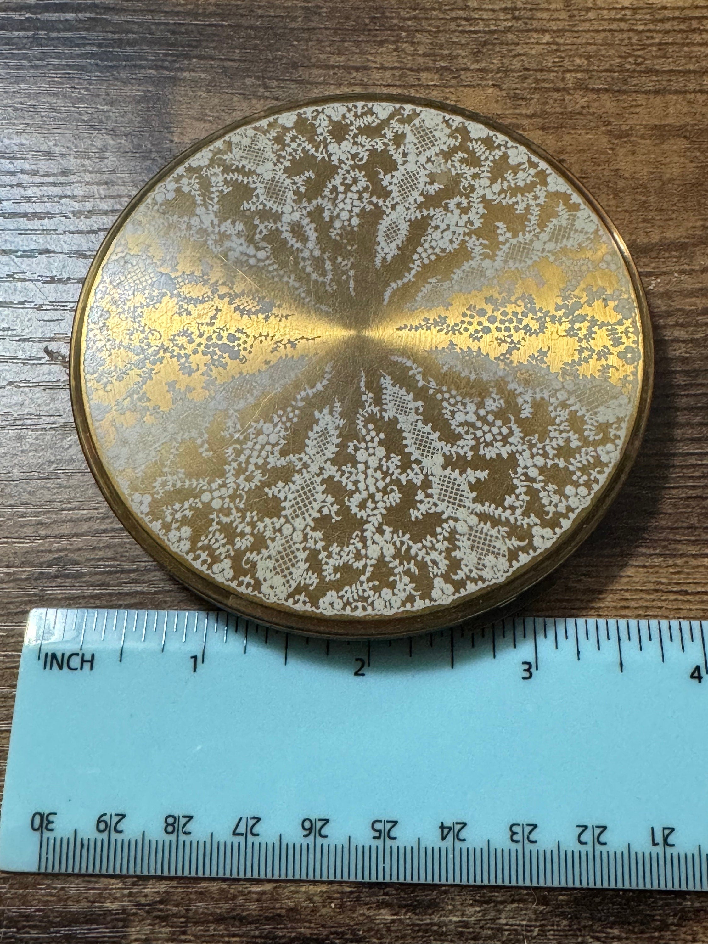 Oversized gold tone giant powder compact white lace design