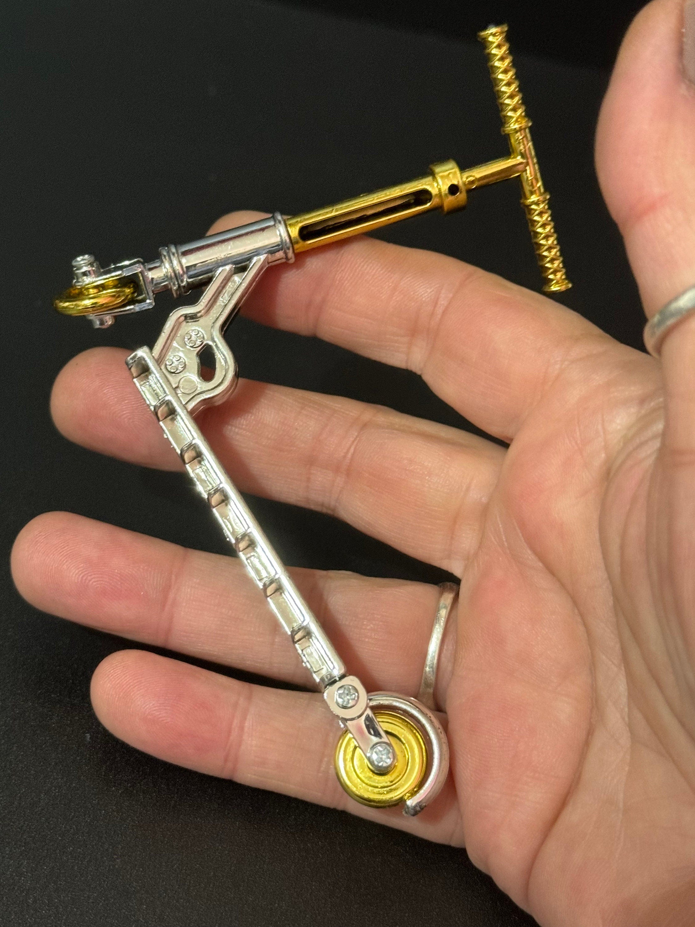 Miniature Gold and silver scooter cake topper decoration plastic finger operated sports