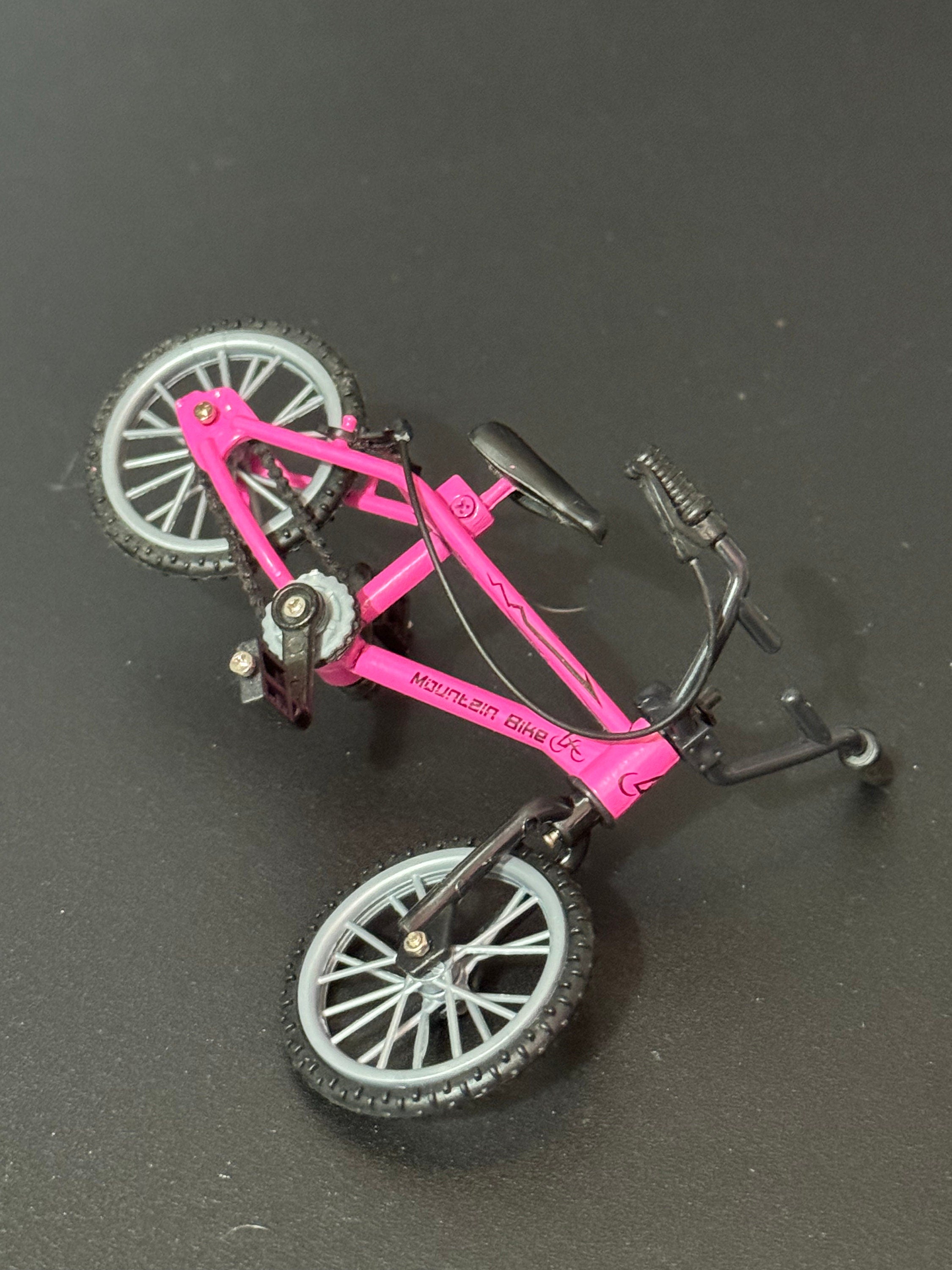 Miniature plastic girls ladies bright pink mountain bike BMX cake topper decoration