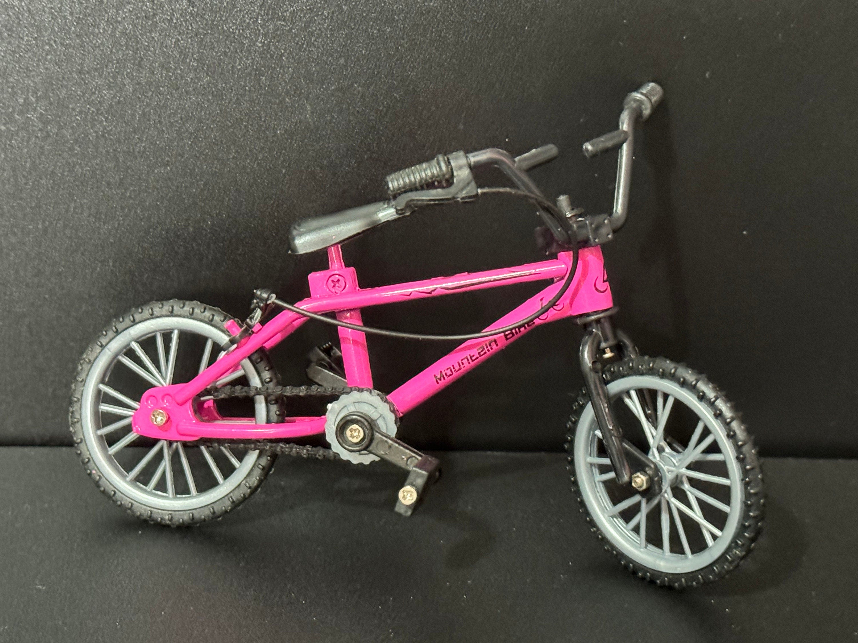 Miniature plastic girls ladies bright pink mountain bike BMX cake topper decoration