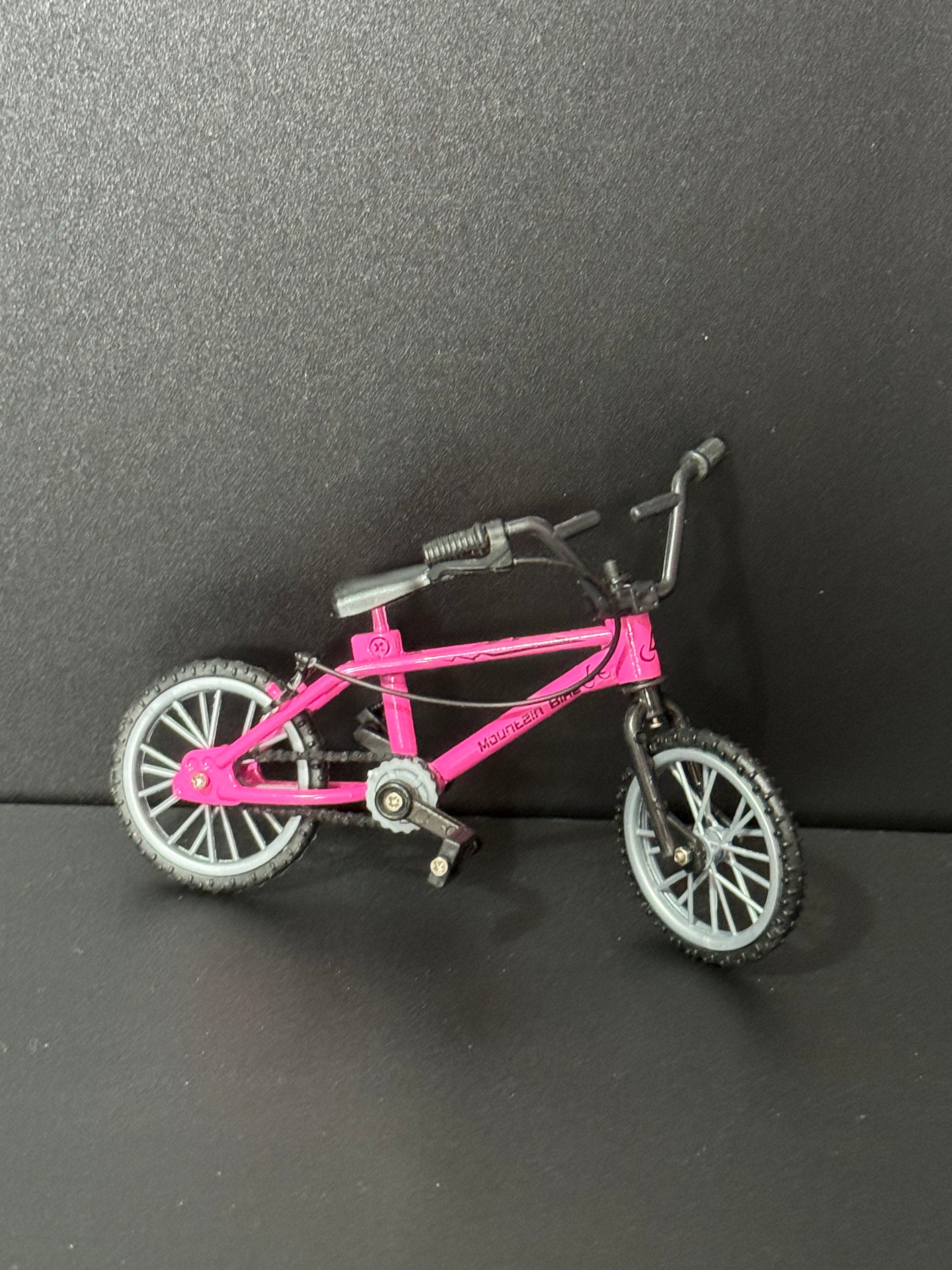 Miniature plastic girls ladies bright pink mountain bike BMX cake topper decoration