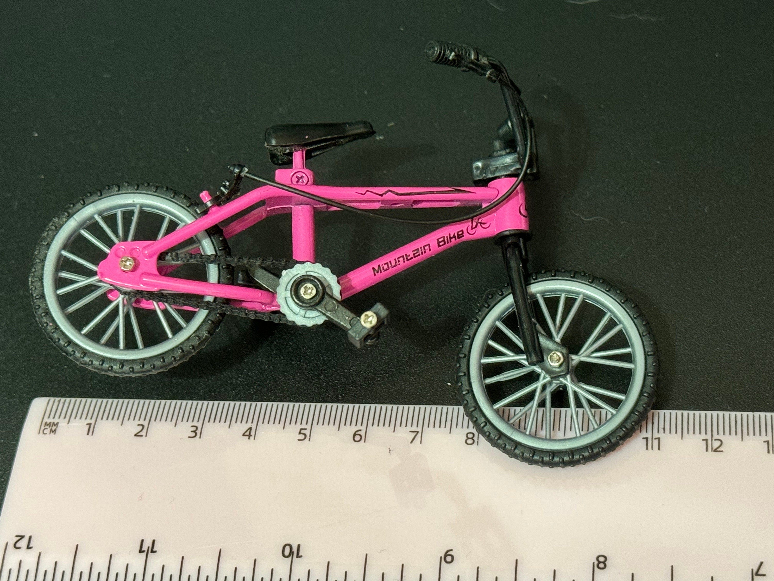 Miniature plastic girls ladies bright pink mountain bike BMX cake topper decoration