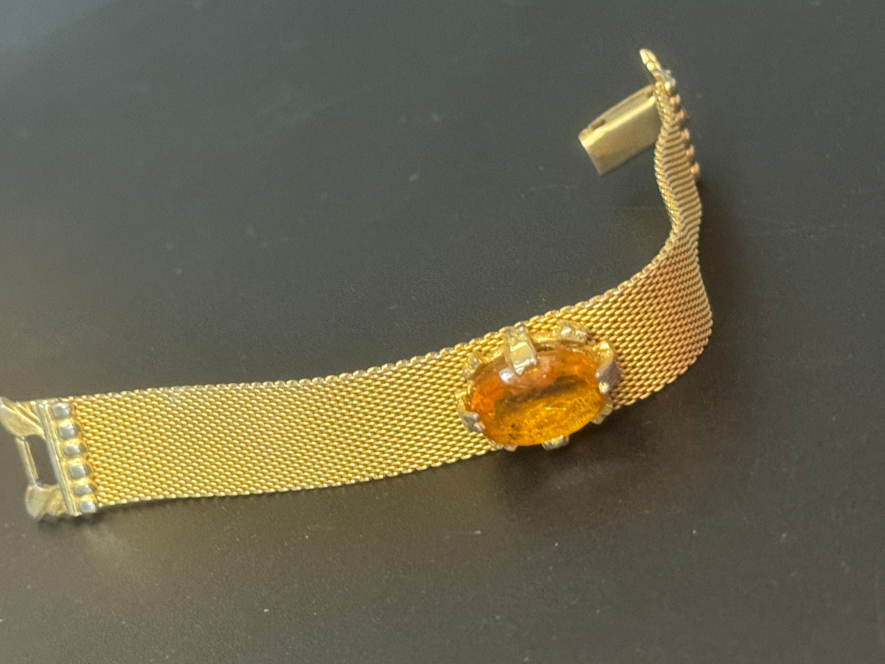 Vintage 1960s gold tone woven flat articulated Mesh bracelet with orange faux citrine cabochon 17.5cm long