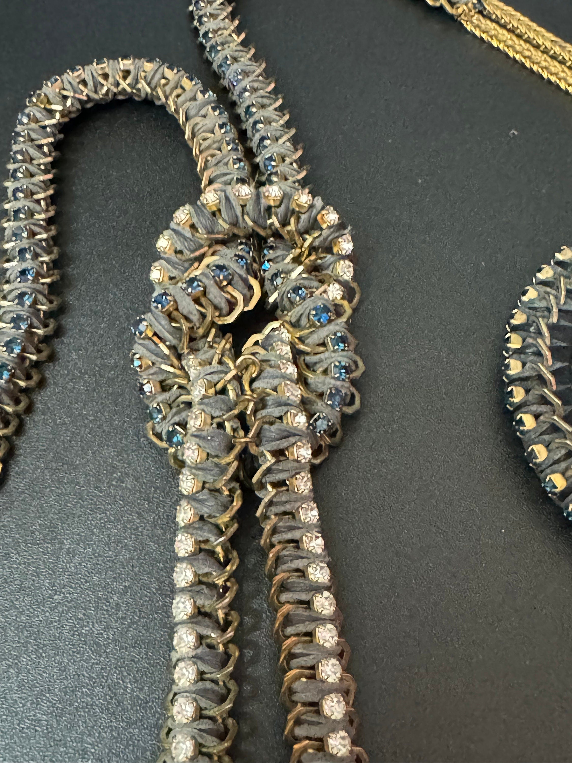 Retro dark blue and clear Swarovski crystal diamanté and grey leather gold tone diamanté knot pendant necklace and matching hoop earrings