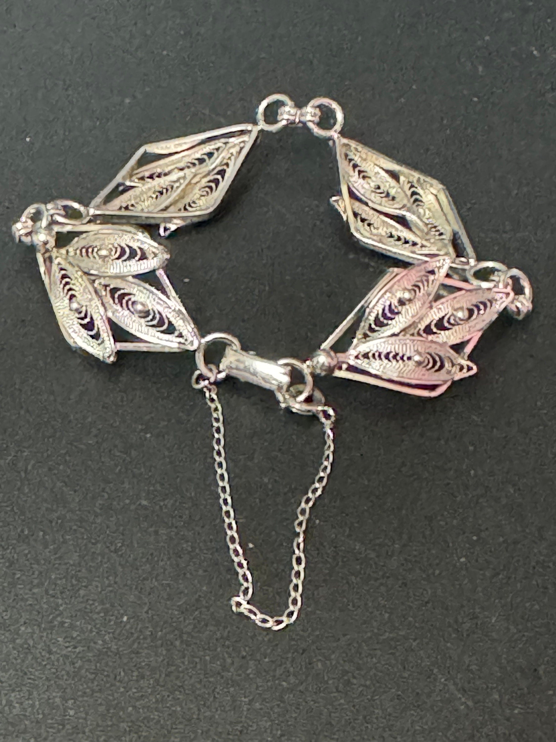 fine filigree work panel link bracelet , silver tone