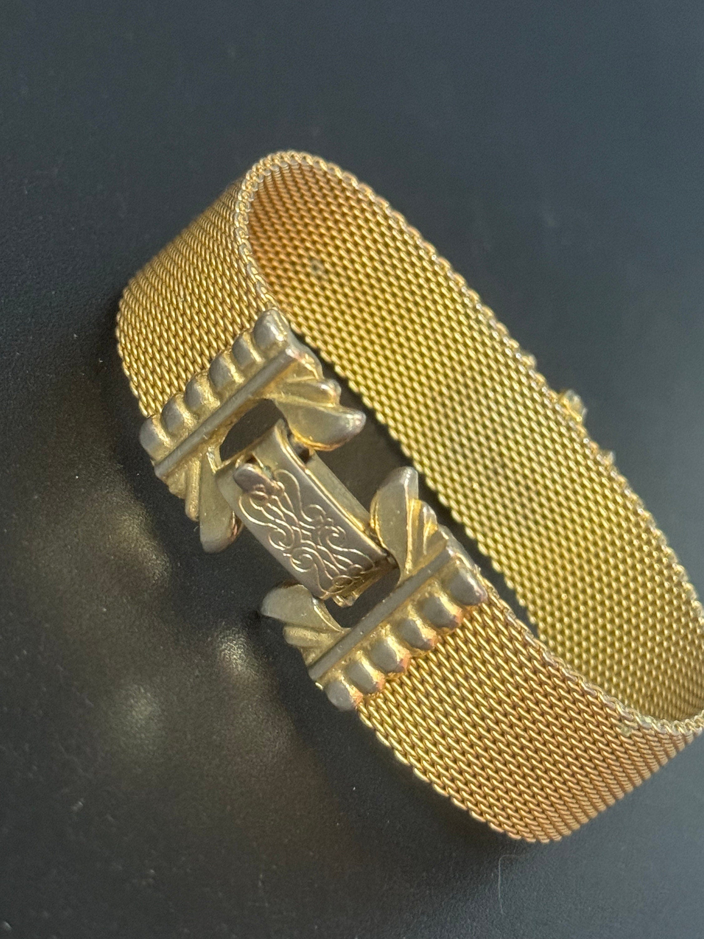 Vintage 1960s gold tone woven flat articulated Mesh bracelet with orange faux citrine cabochon 17.5cm long