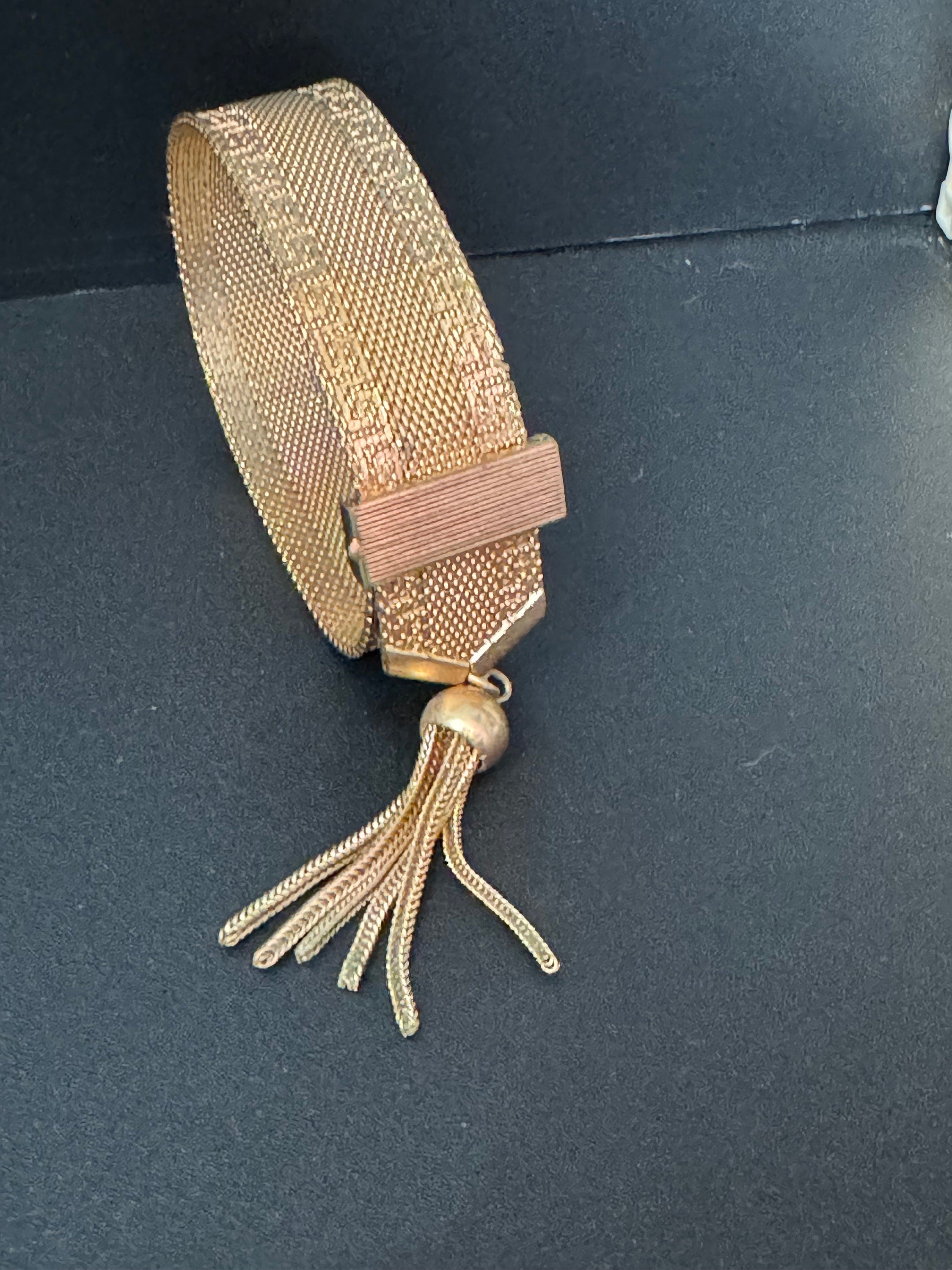 1970s Greek key design gold tone articulated flat 2cm wide tassel bracelet 19cm