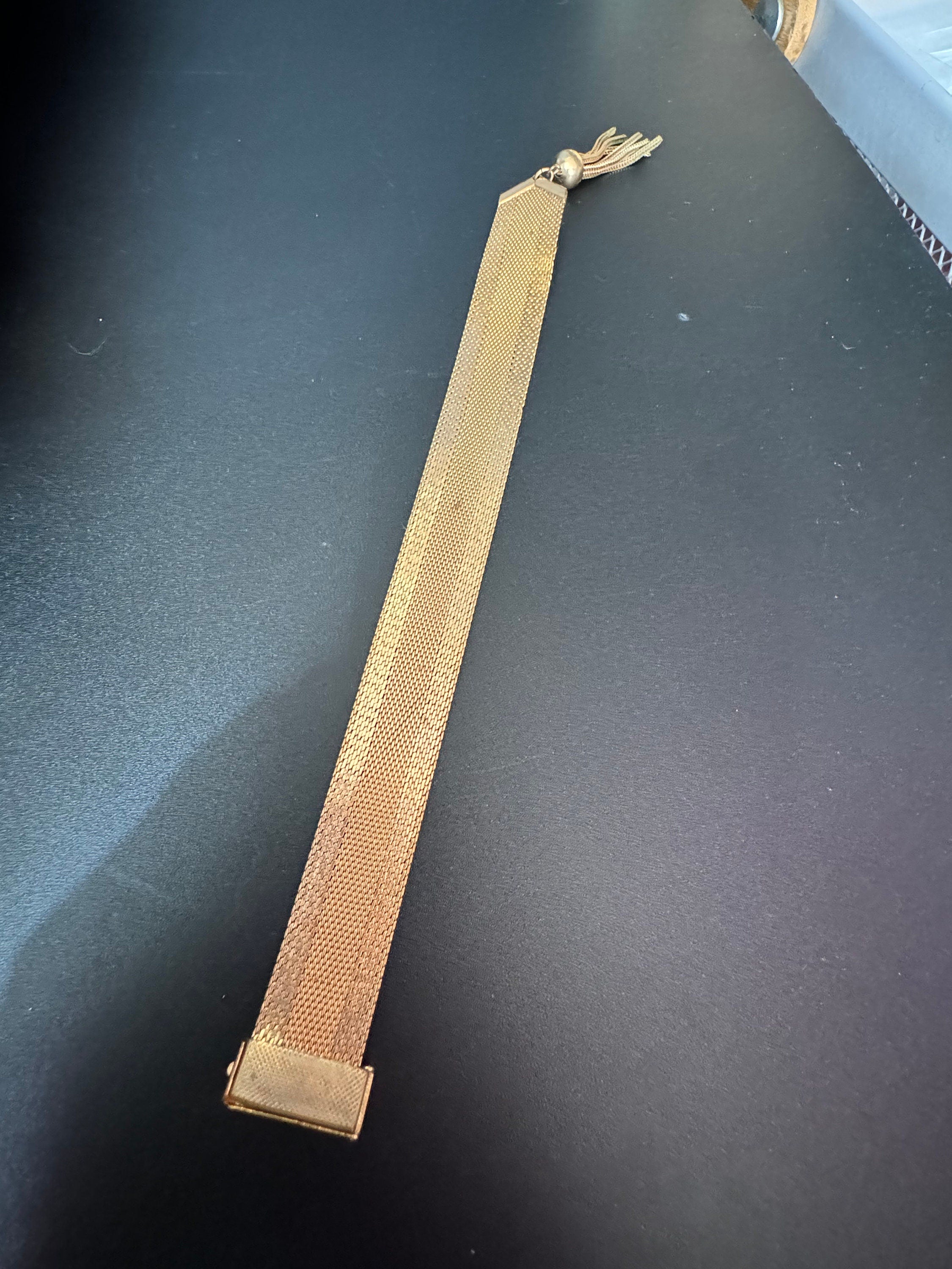 1970s Greek key design gold tone articulated flat 2cm wide tassel bracelet 19cm