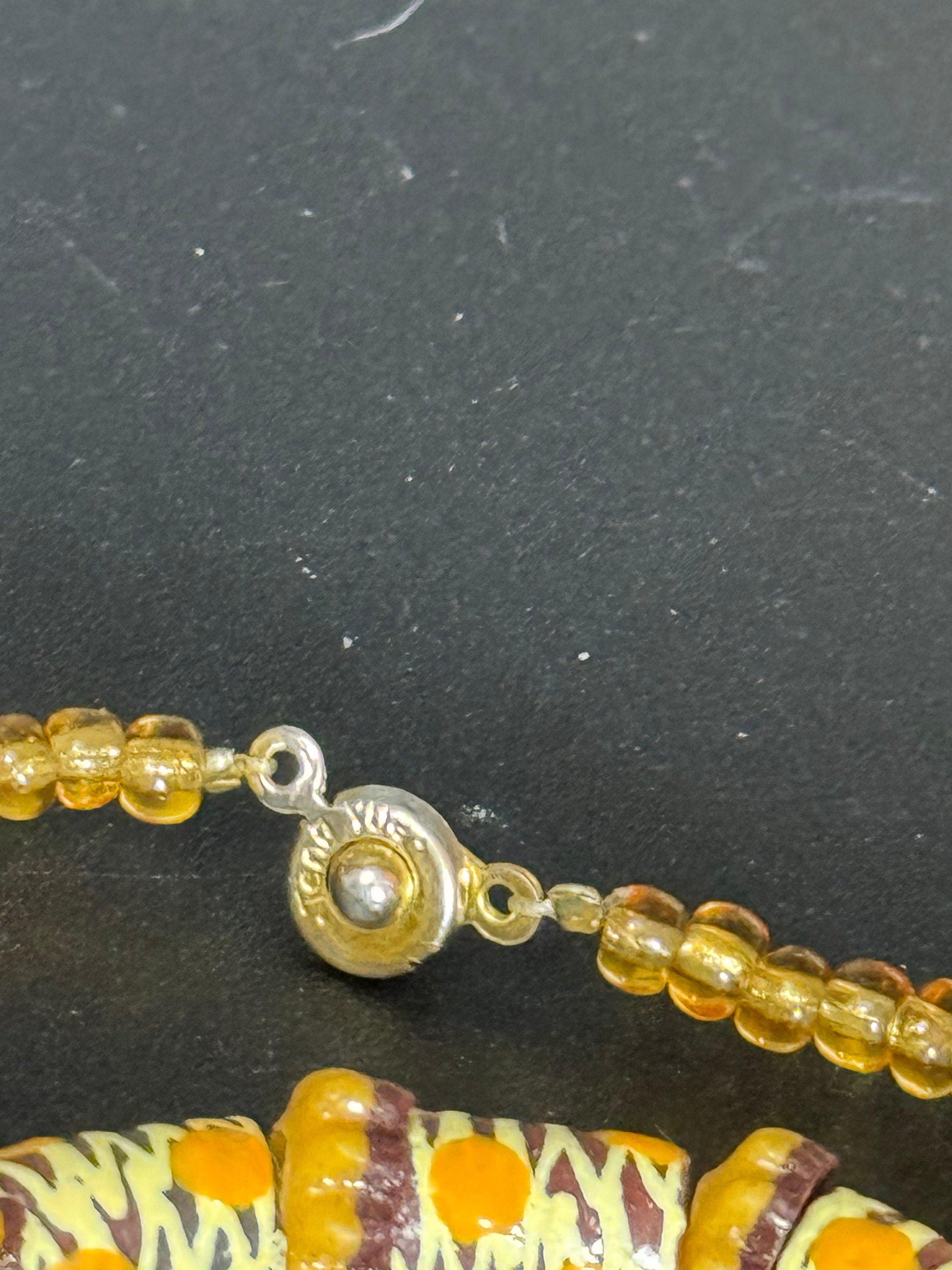 Signed Teng Yue african colours red ochre and mustard glass beaded necklace and stretch bracelet jewellery set