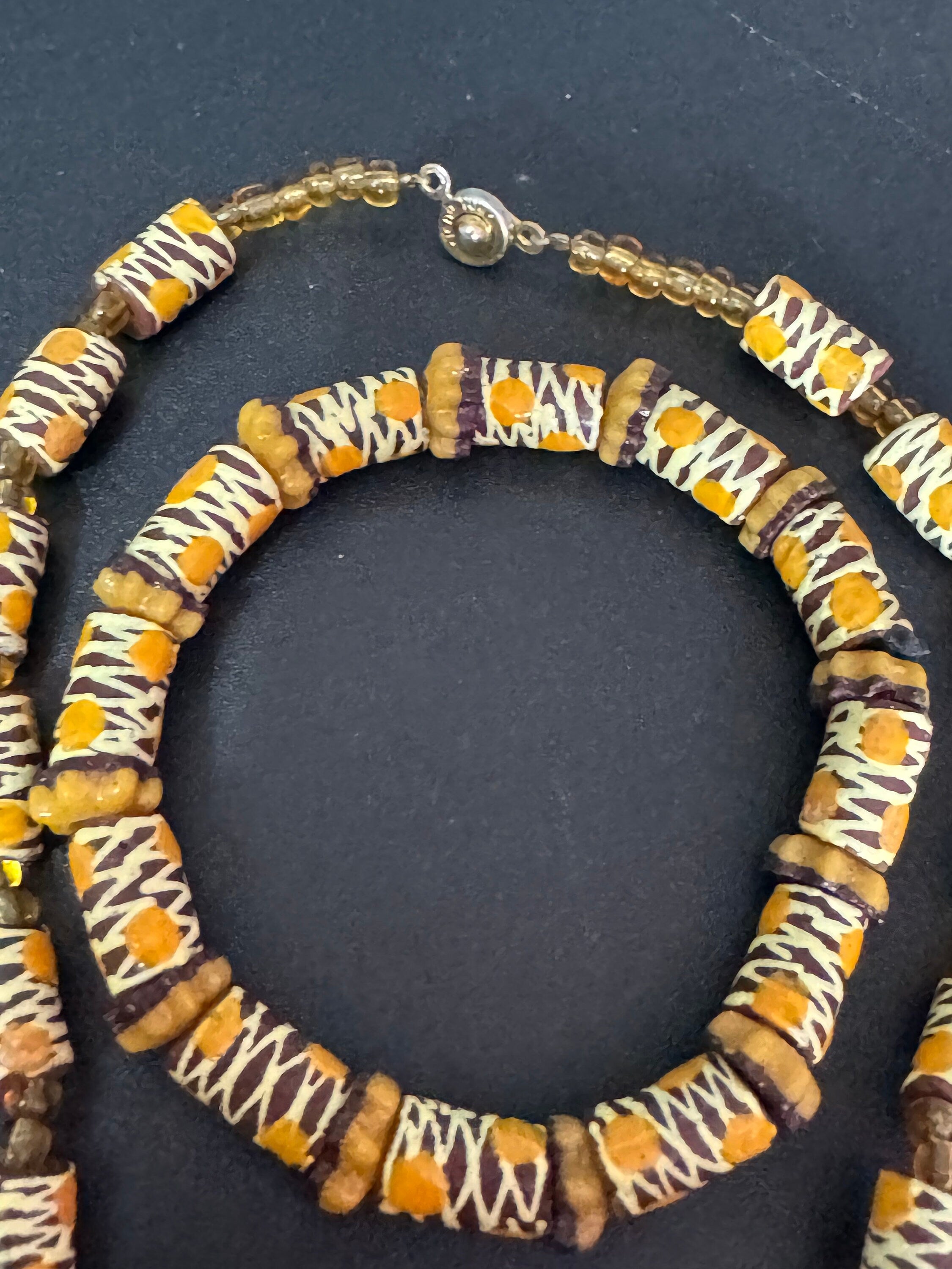 Signed Teng Yue african colours red ochre and mustard glass beaded necklace and stretch bracelet jewellery set