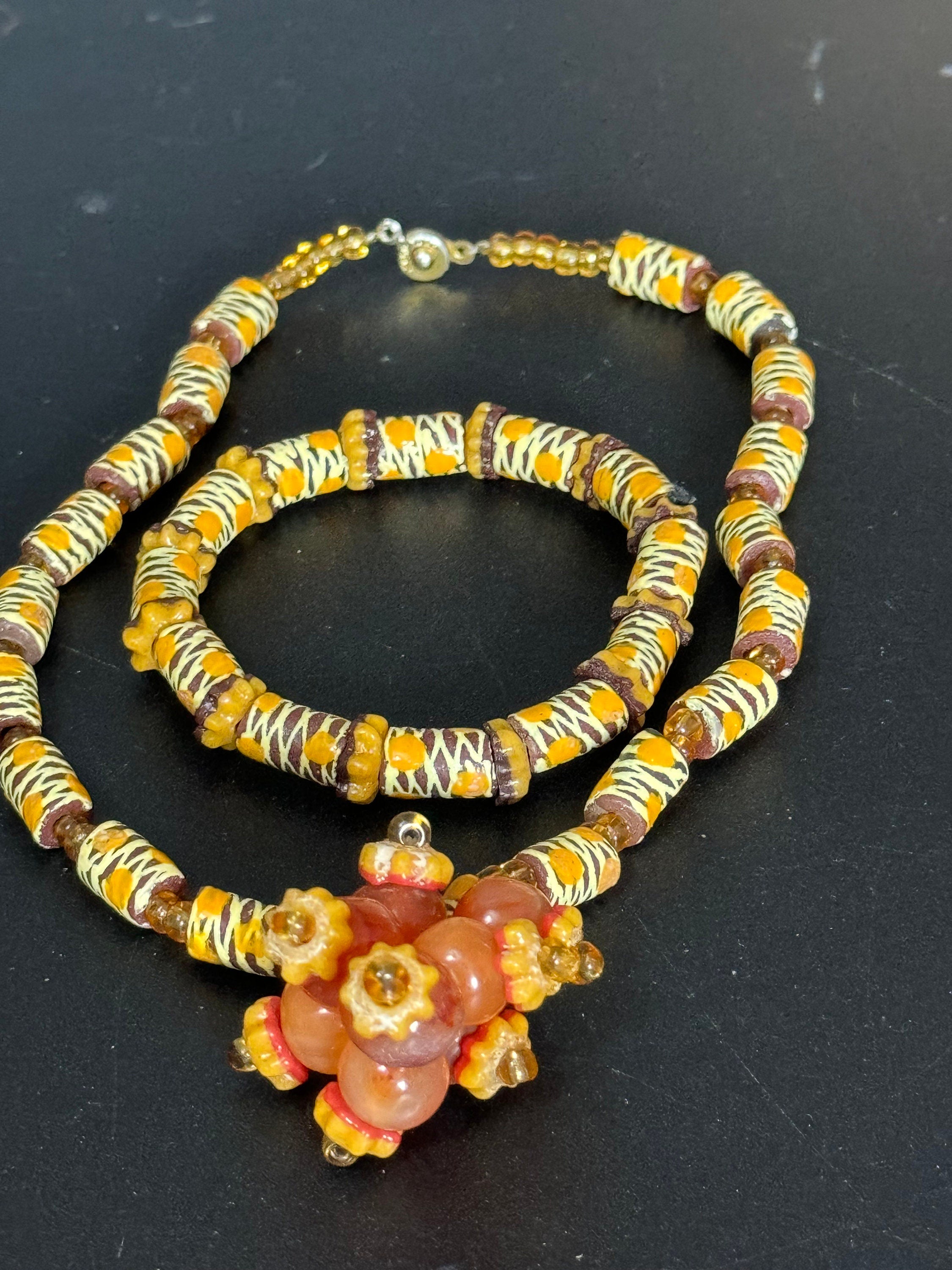 Signed Teng Yue african colours red ochre and mustard glass beaded necklace and stretch bracelet jewellery set