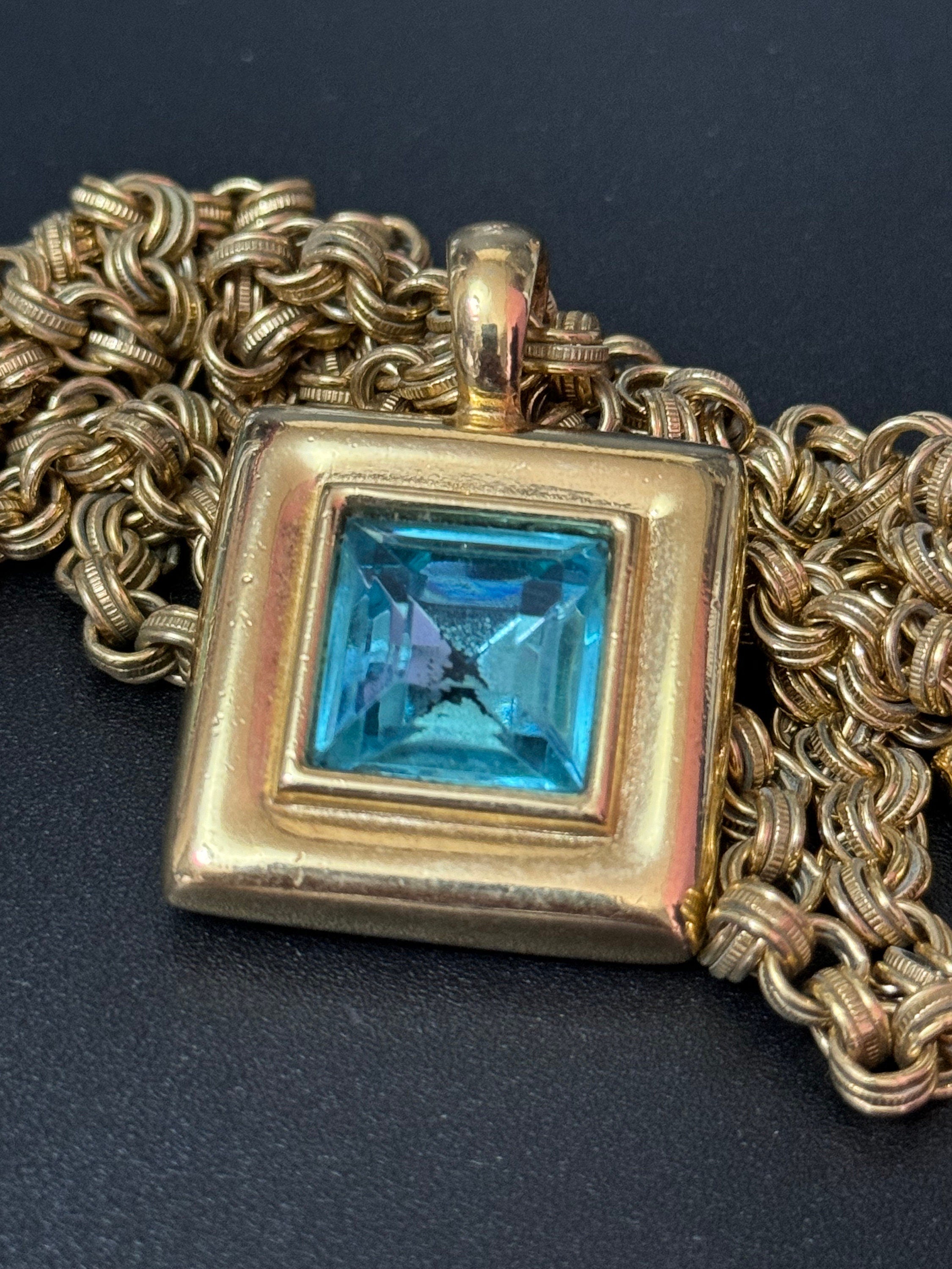 Circa 1980s Givenchy, gold plated square turquoise blue crystal pendant necklace on signed 80cm toggle chain, New York designer