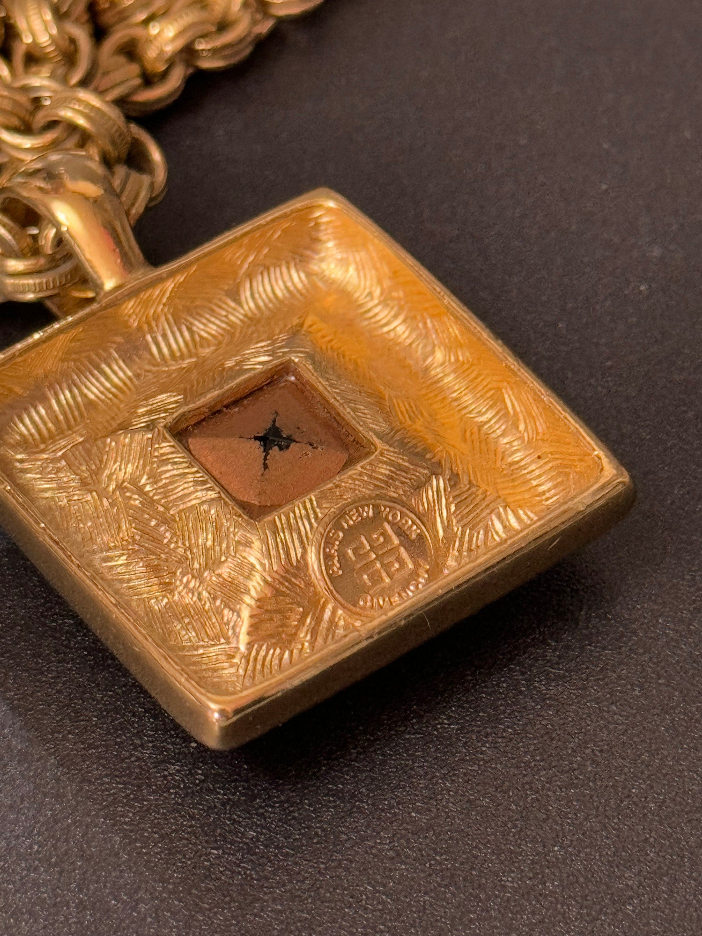 Circa 1980s Givenchy, gold plated square turquoise blue crystal pendant necklace on signed 80cm toggle chain, New York designer