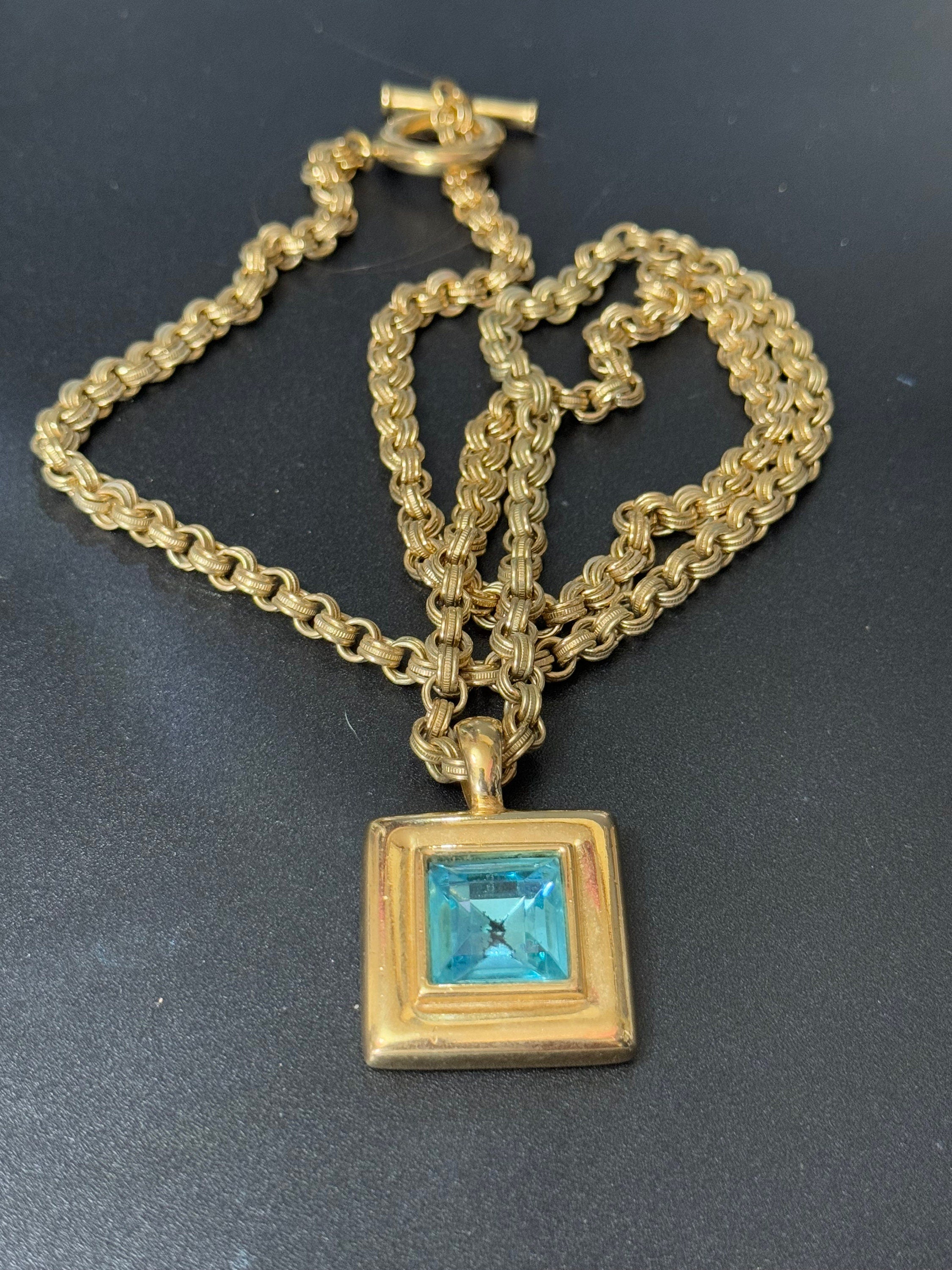 Circa 1980s Givenchy, gold plated square turquoise blue crystal pendant necklace on signed 80cm toggle chain, New York designer