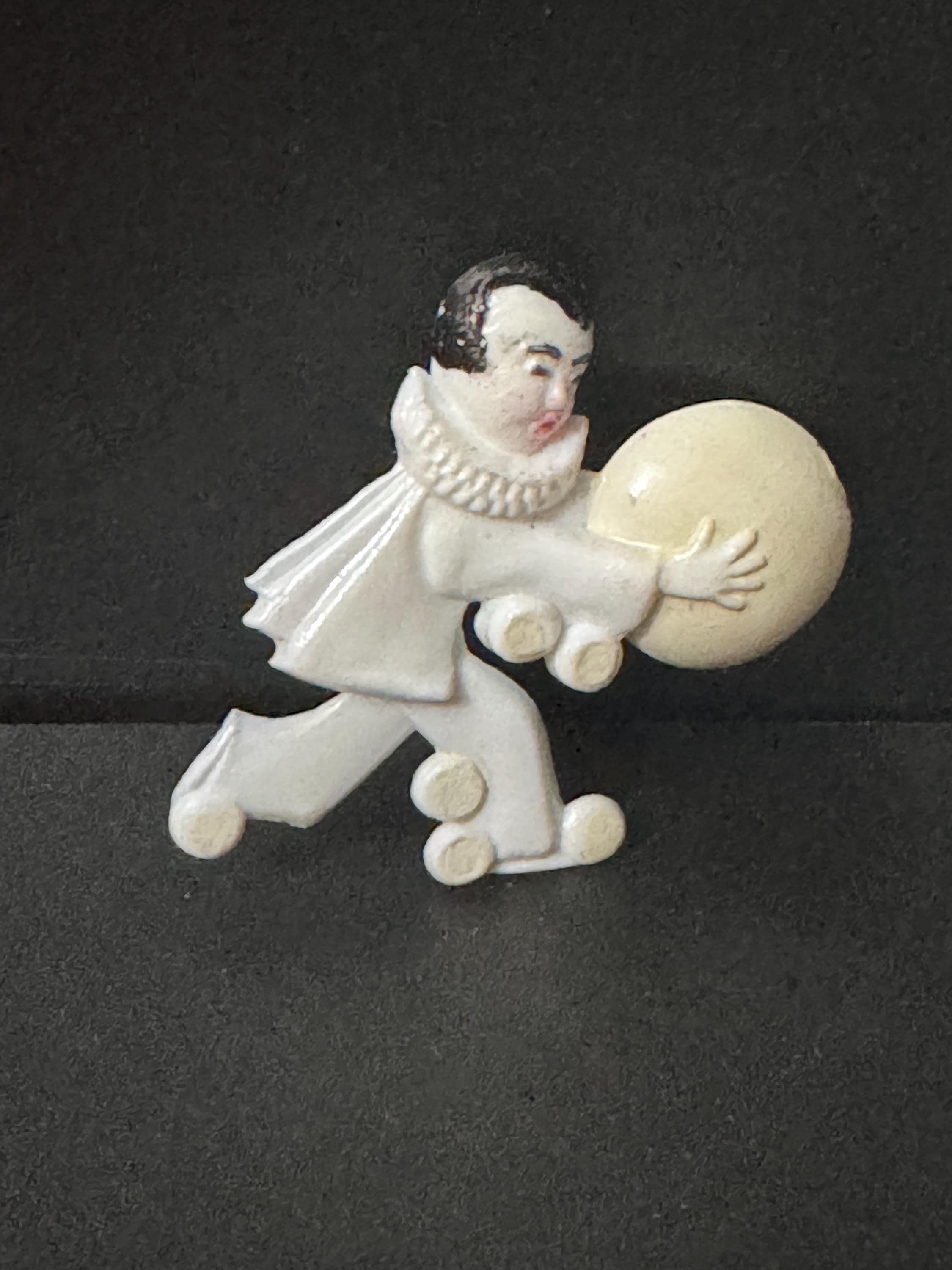 White Pierrot brooch old