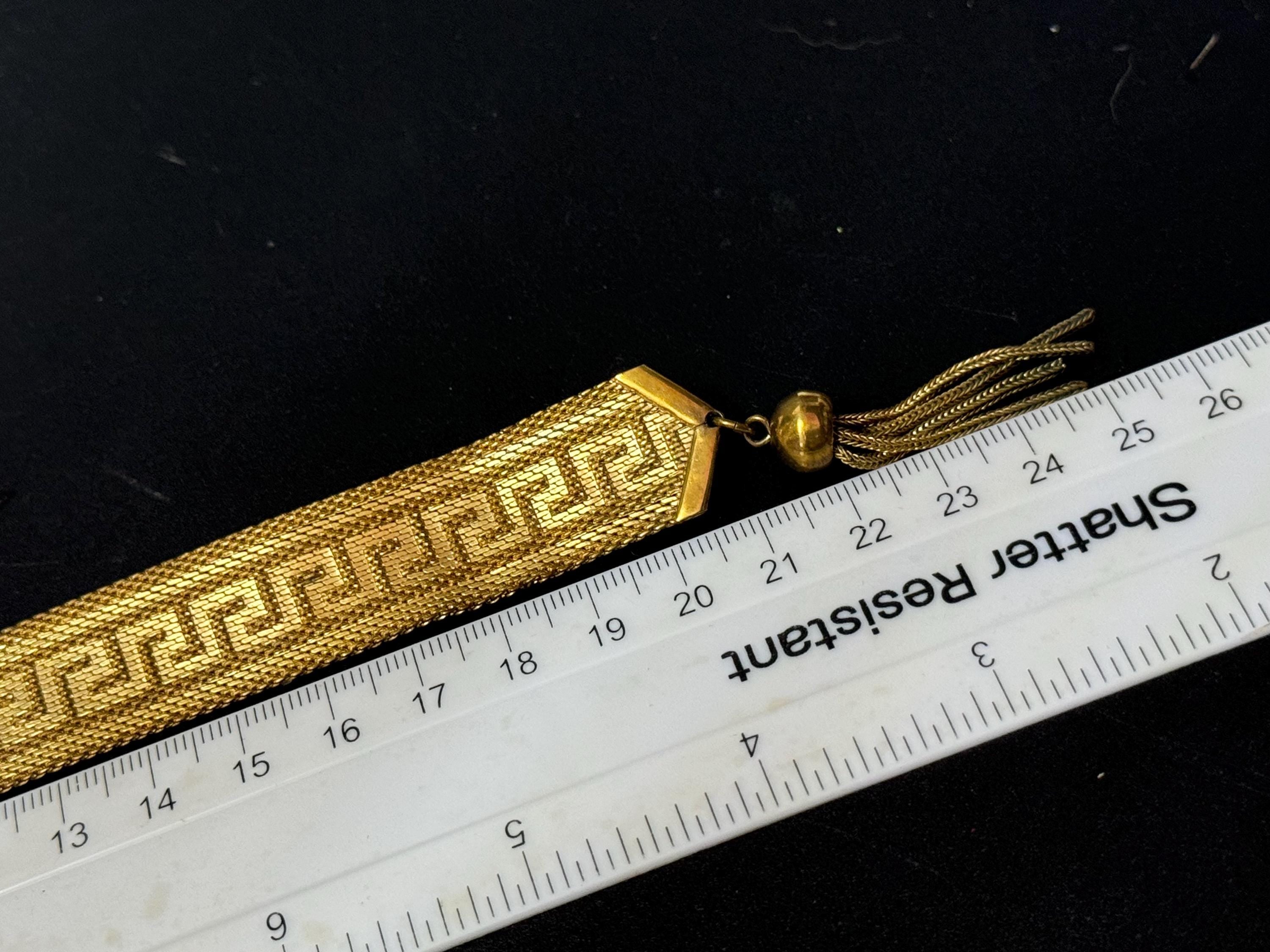 1970s Greek key design gold tone articulated flat 2cm wide tassel bracelet 19.5