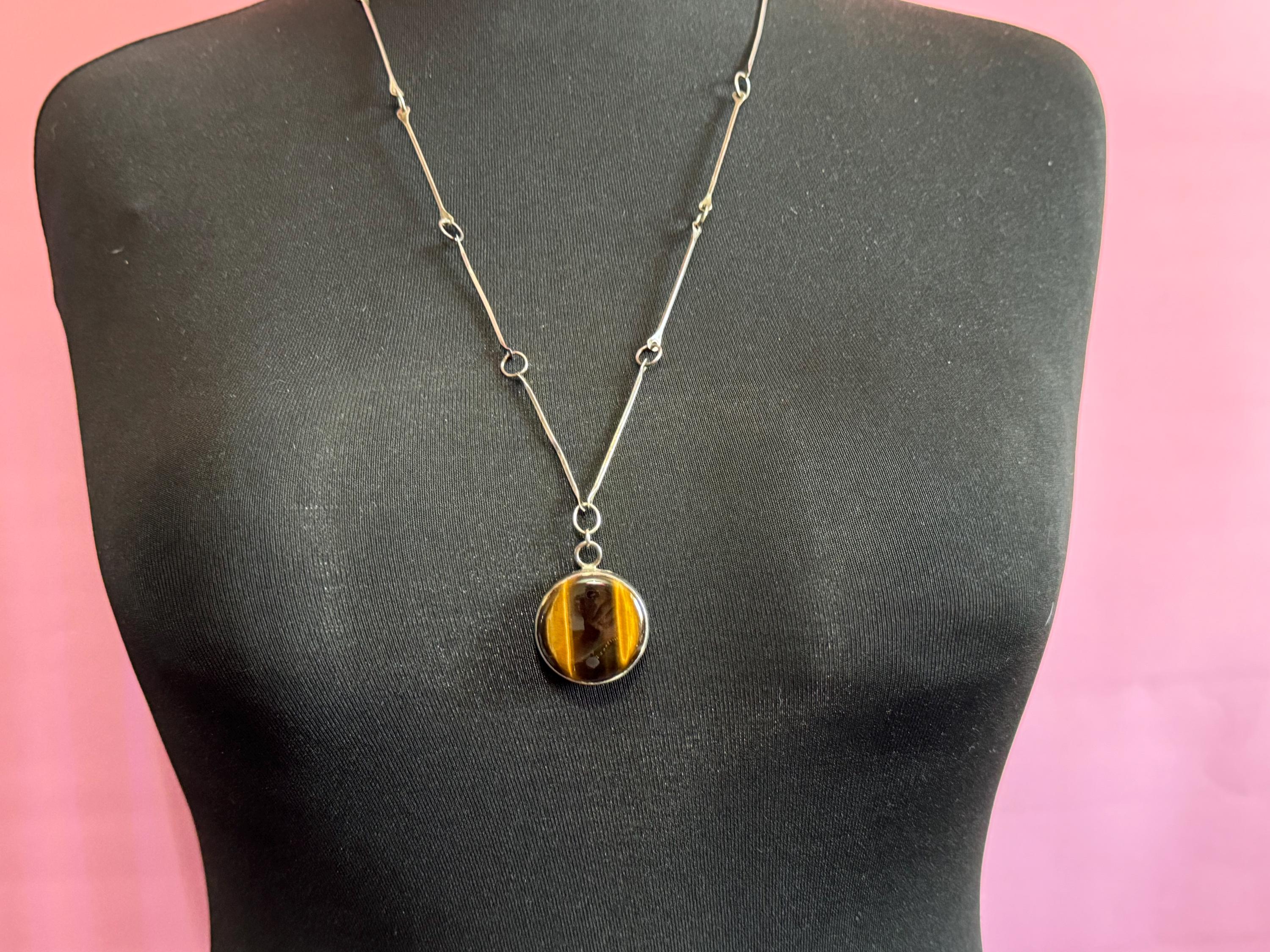 Solid silver long tigers eye round pendant necklace on 75cm chain 917 grade Naples or Malta 1970s weighs 25.5 grams