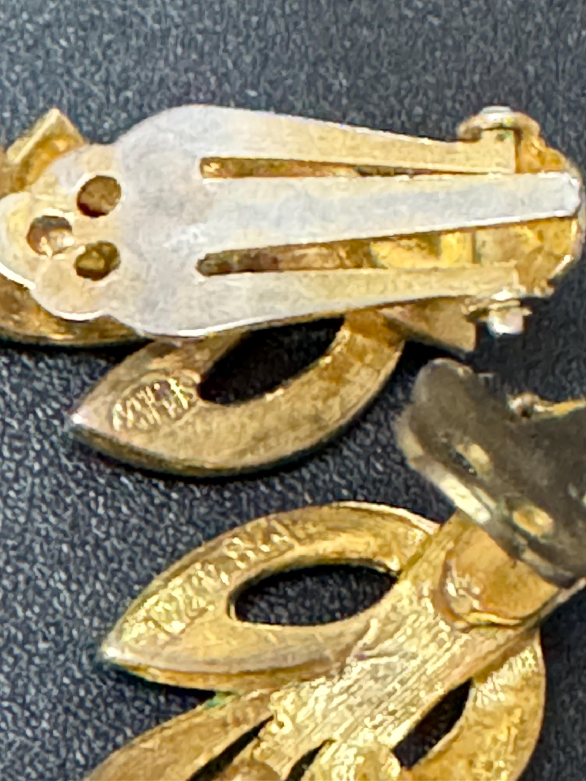 Signed sphinx gold clip on earrings, geometric vintage