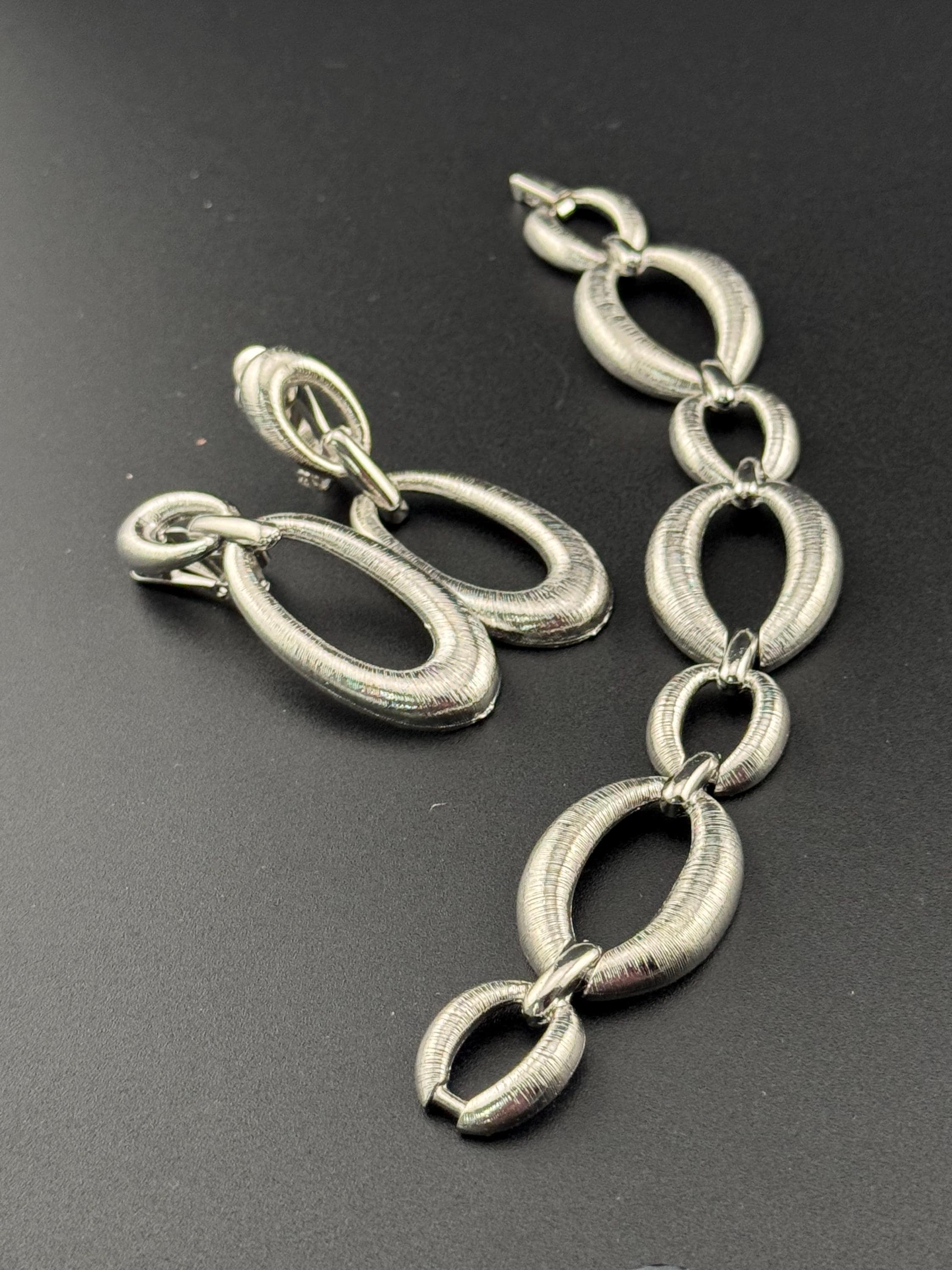 True vintage silver tone textured panel link bracelet and matching clip on drop earrings