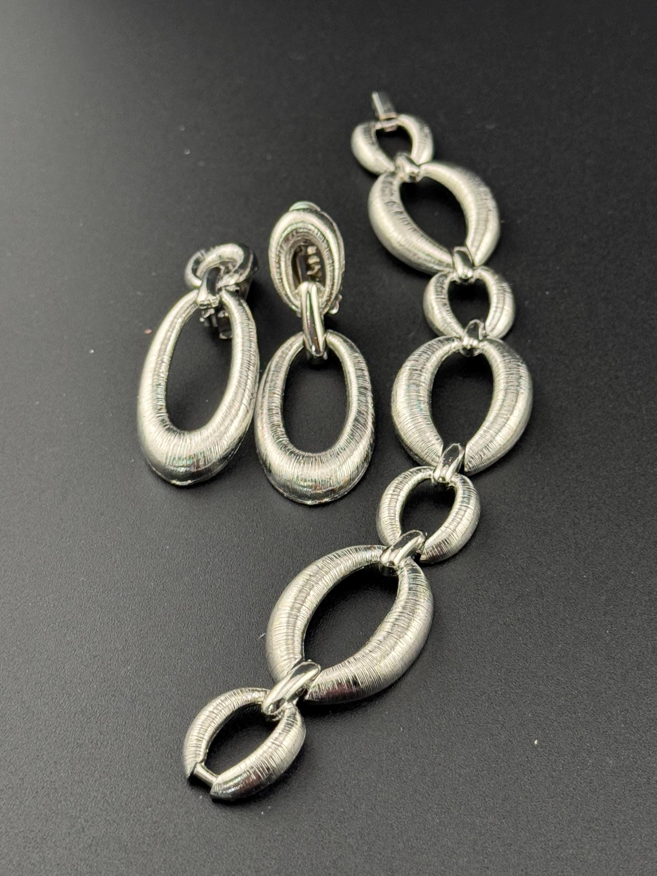 True vintage silver tone textured panel link bracelet and matching clip on drop earrings
