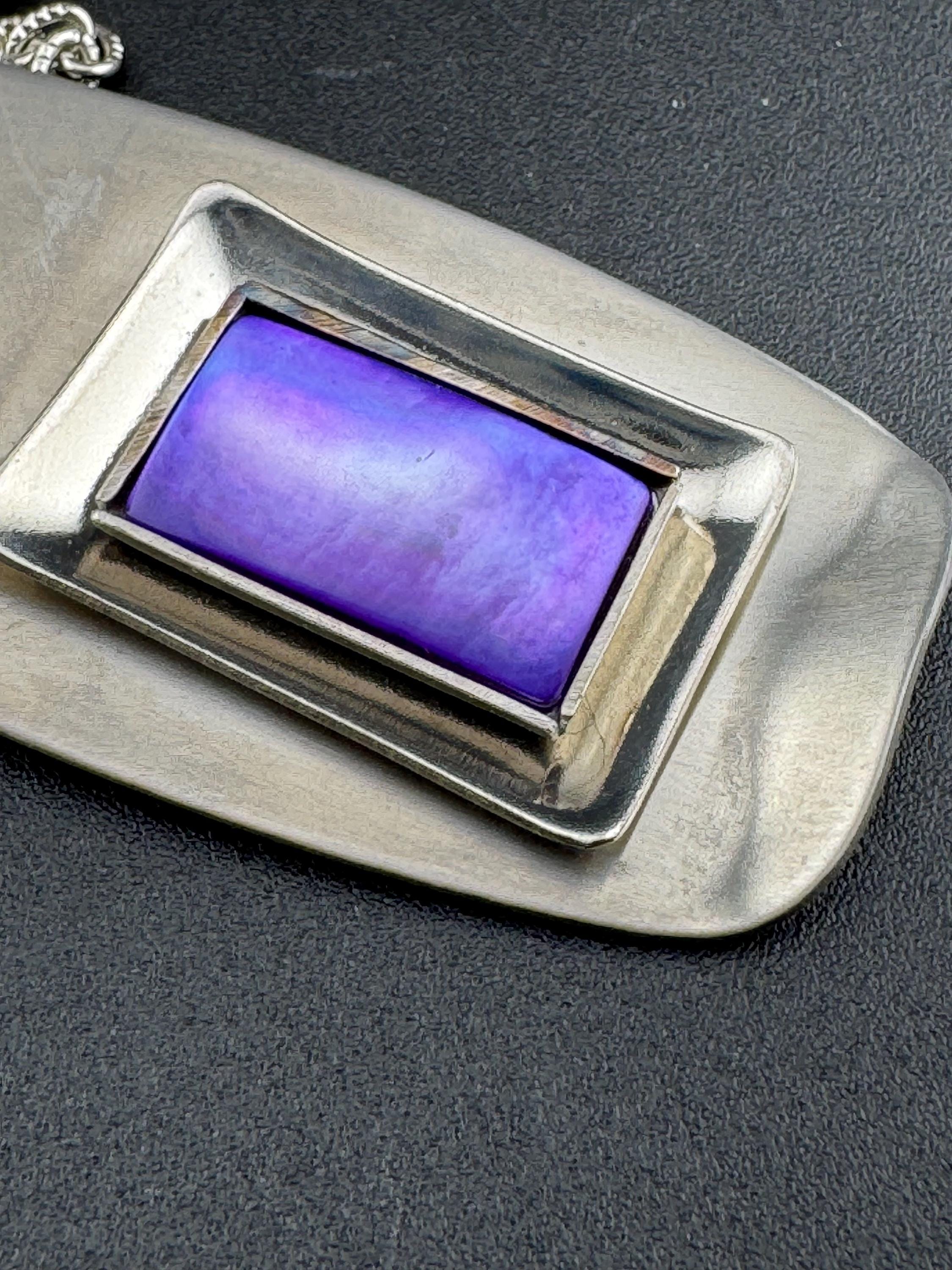 Signed Lord python Vintage Modernist silver tone stainless steel pendant necklace and chain set with central purple glass cabochon 1970s