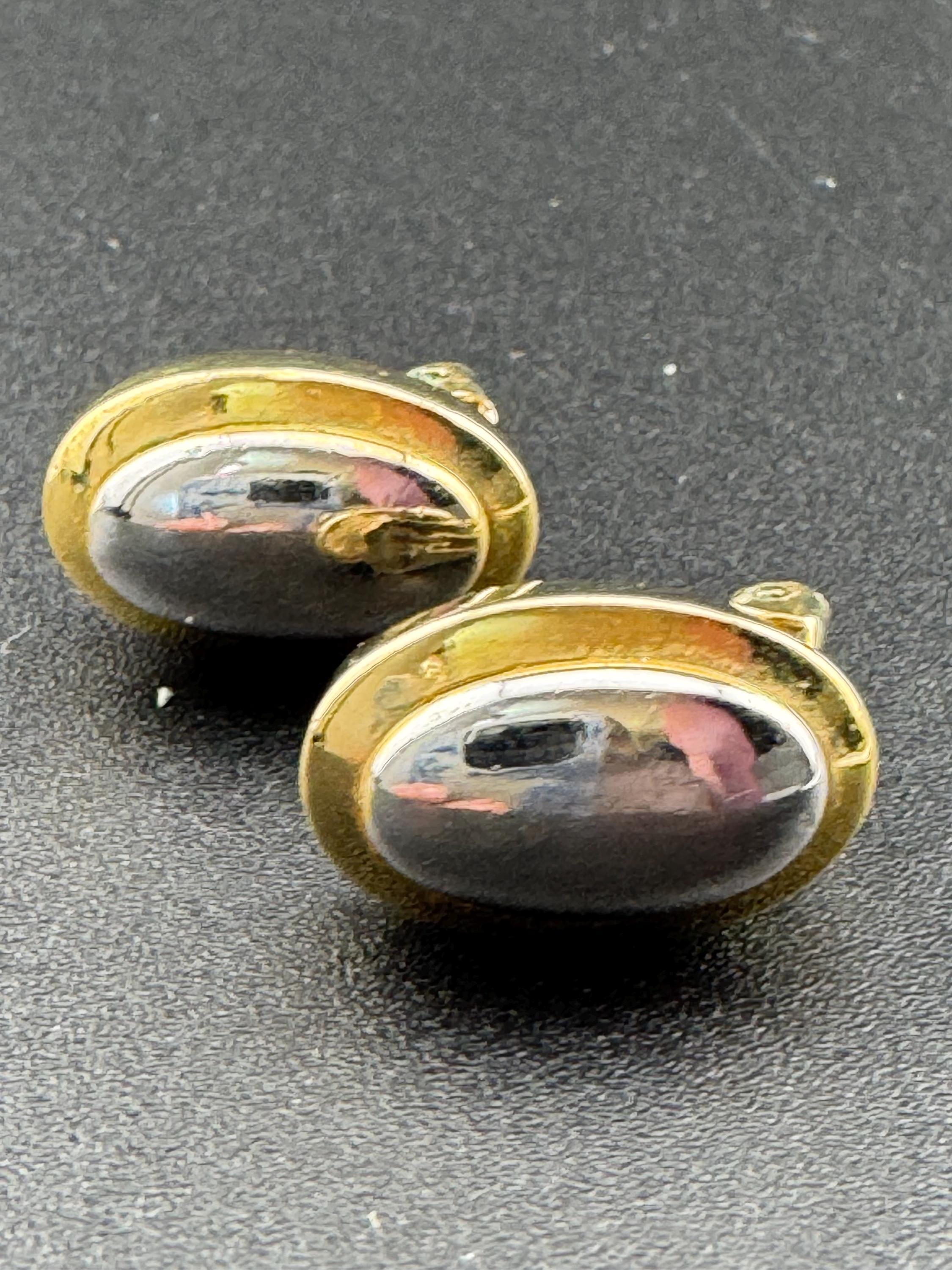 Vintage signed GROSSE gold tone and silver small oval pierced stud earrings