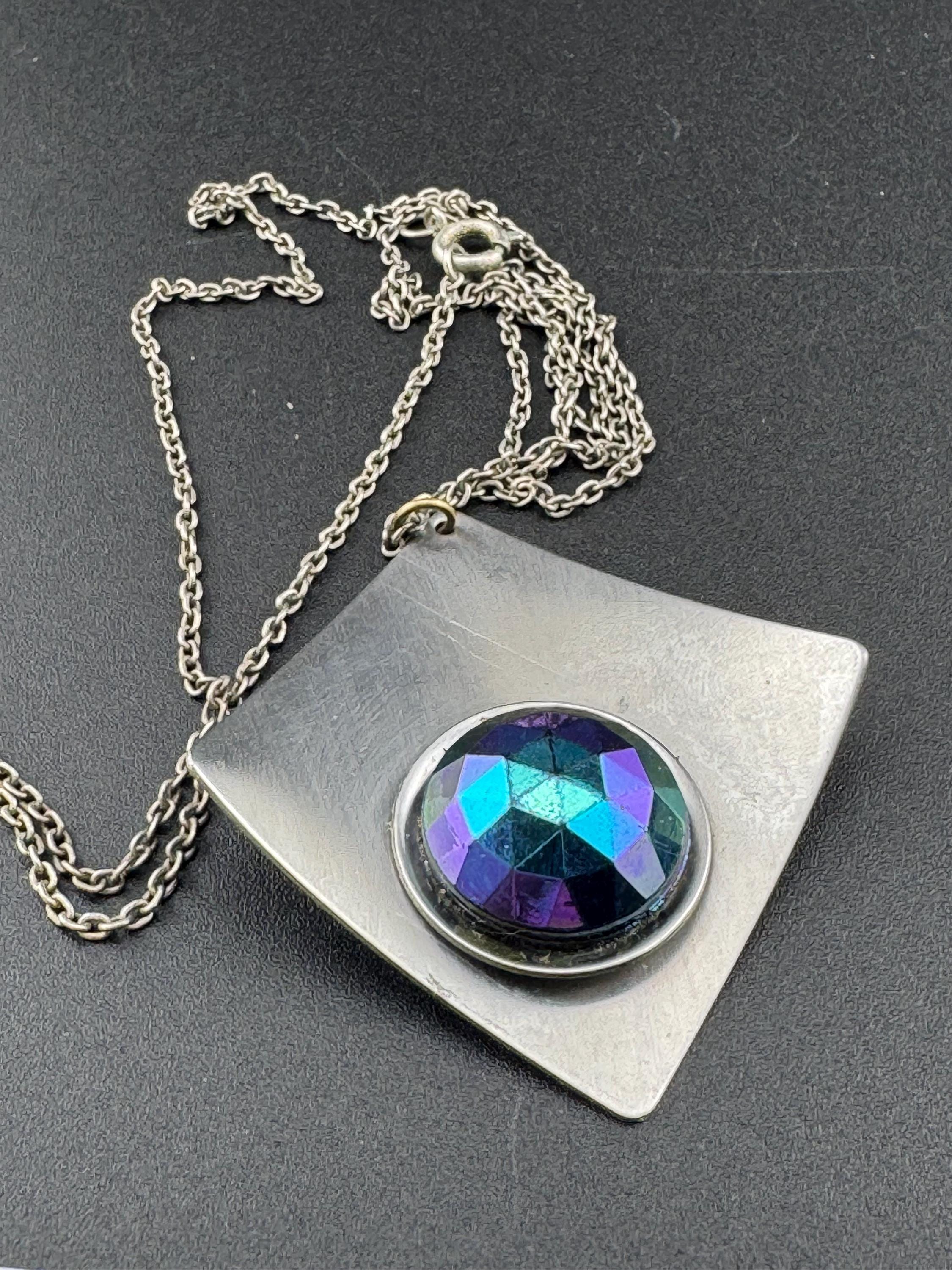 Vintage Modernist silver tone stainless steel pendant necklace and chain set with central domed rainbow glass cabochon 1970s