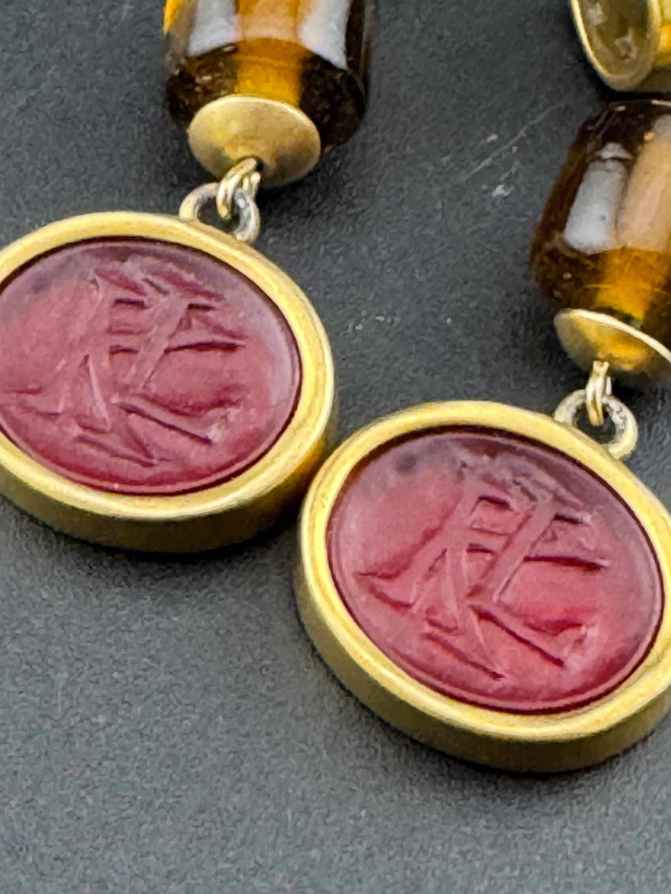 Vintage Signed Karl Lagerfeld long gold red beaded dangly KL logo earrings, high end designer