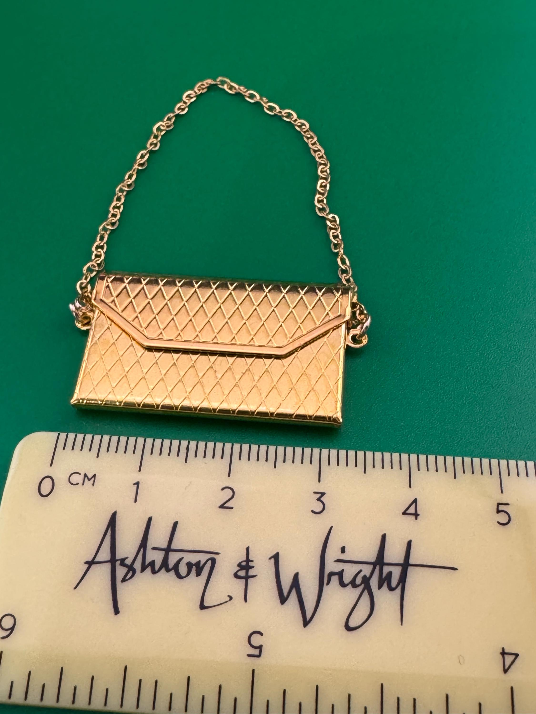 miniature gold clutch chain handbag cake topper decoration for a dolls cake