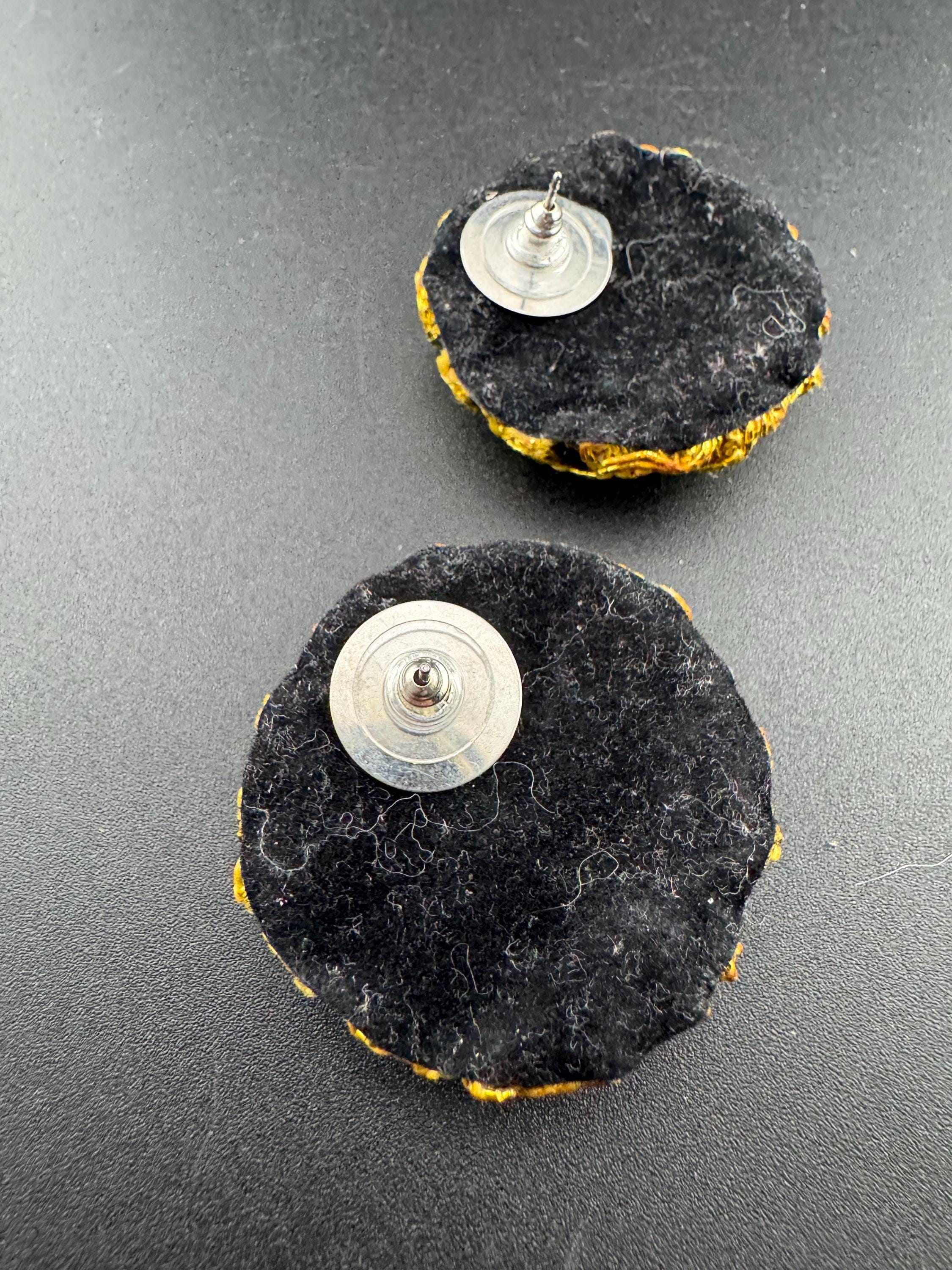 Oversized black velvet low domed disc pierced earrings with gold tone braiding, big studs
