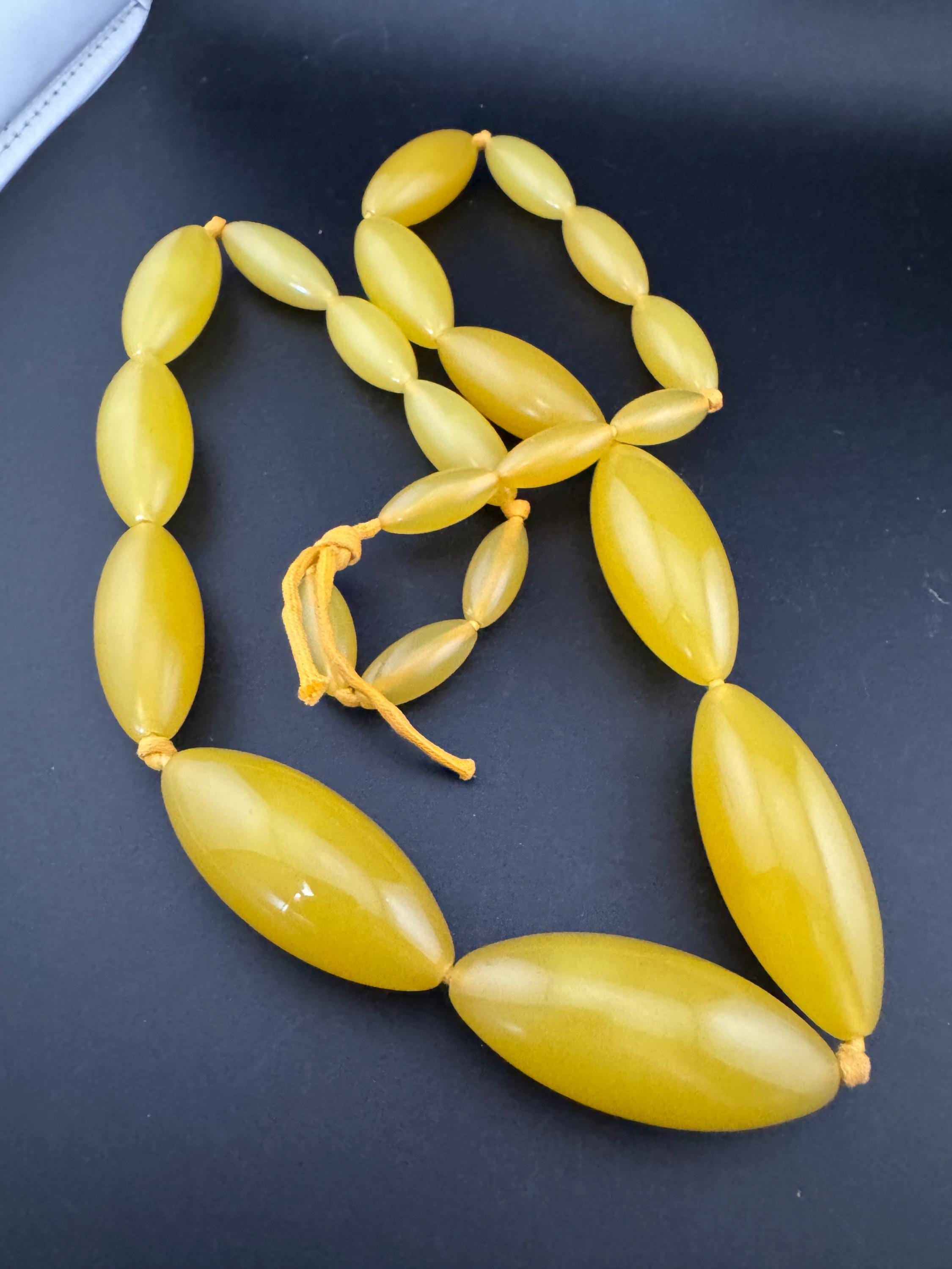 Vintage early plastic beaded long beaded necklace autumnal orange yellow on knotted cord
