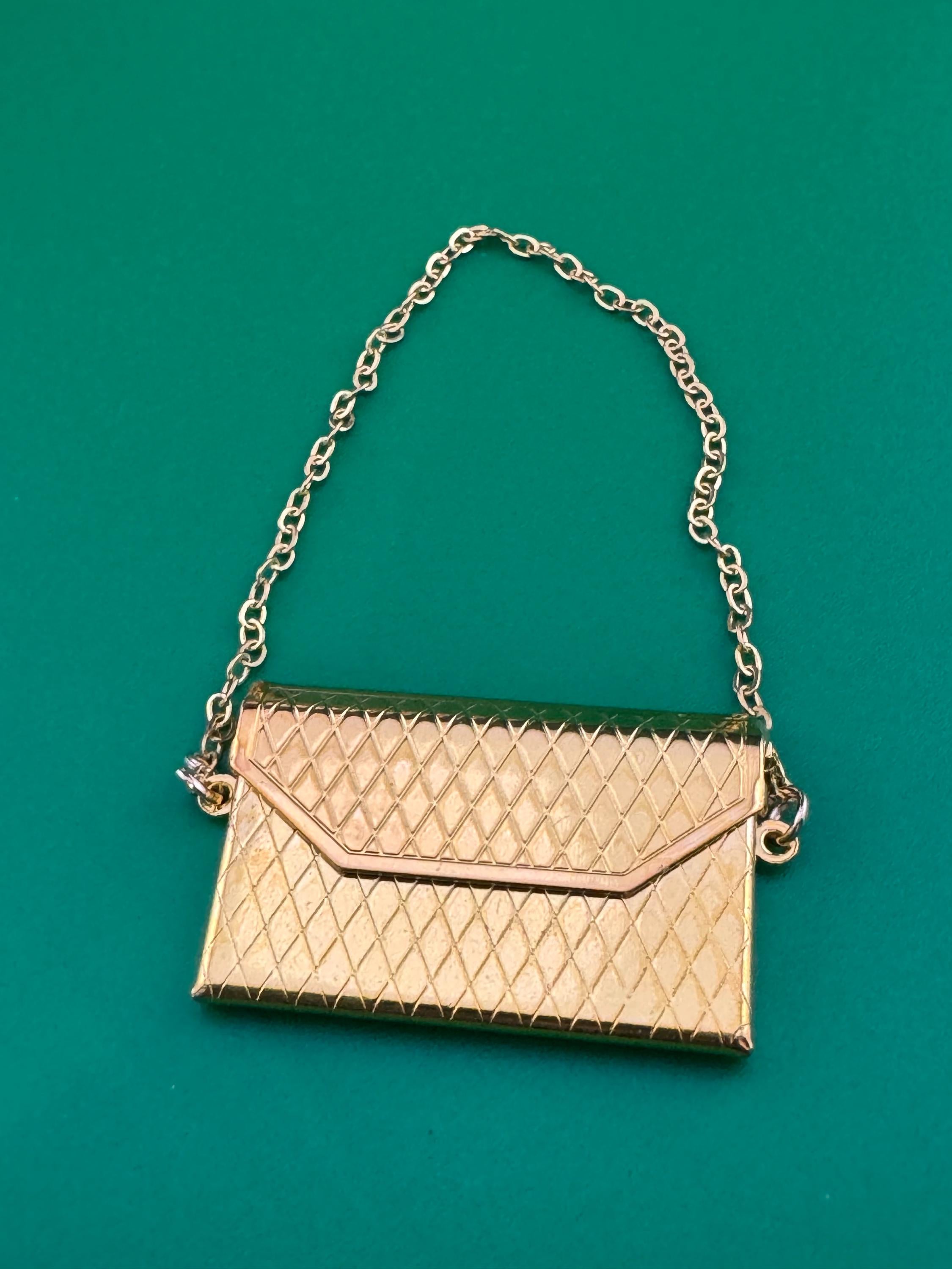 miniature gold clutch chain handbag cake topper decoration for a dolls cake