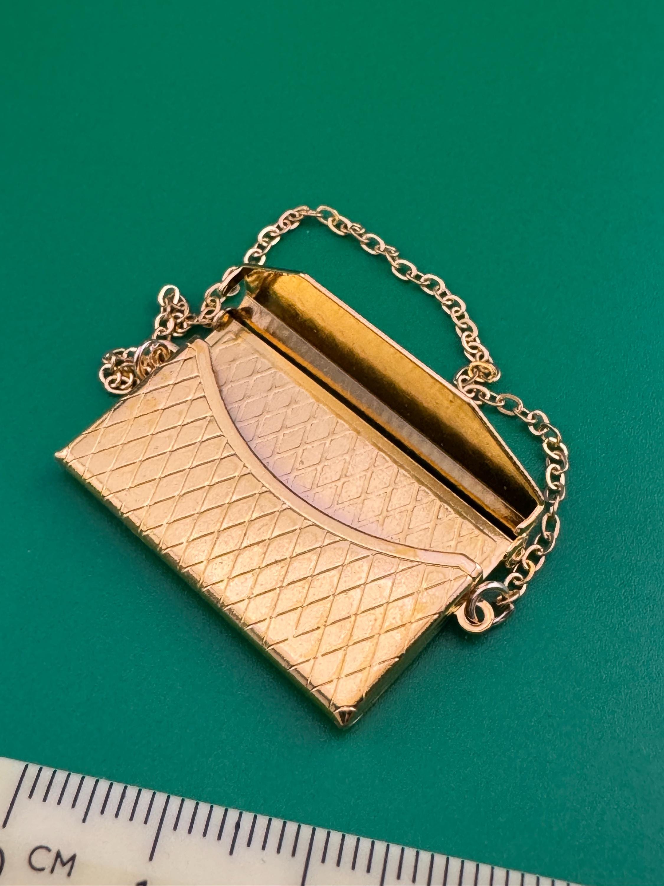 miniature gold clutch chain handbag cake topper decoration for a dolls cake