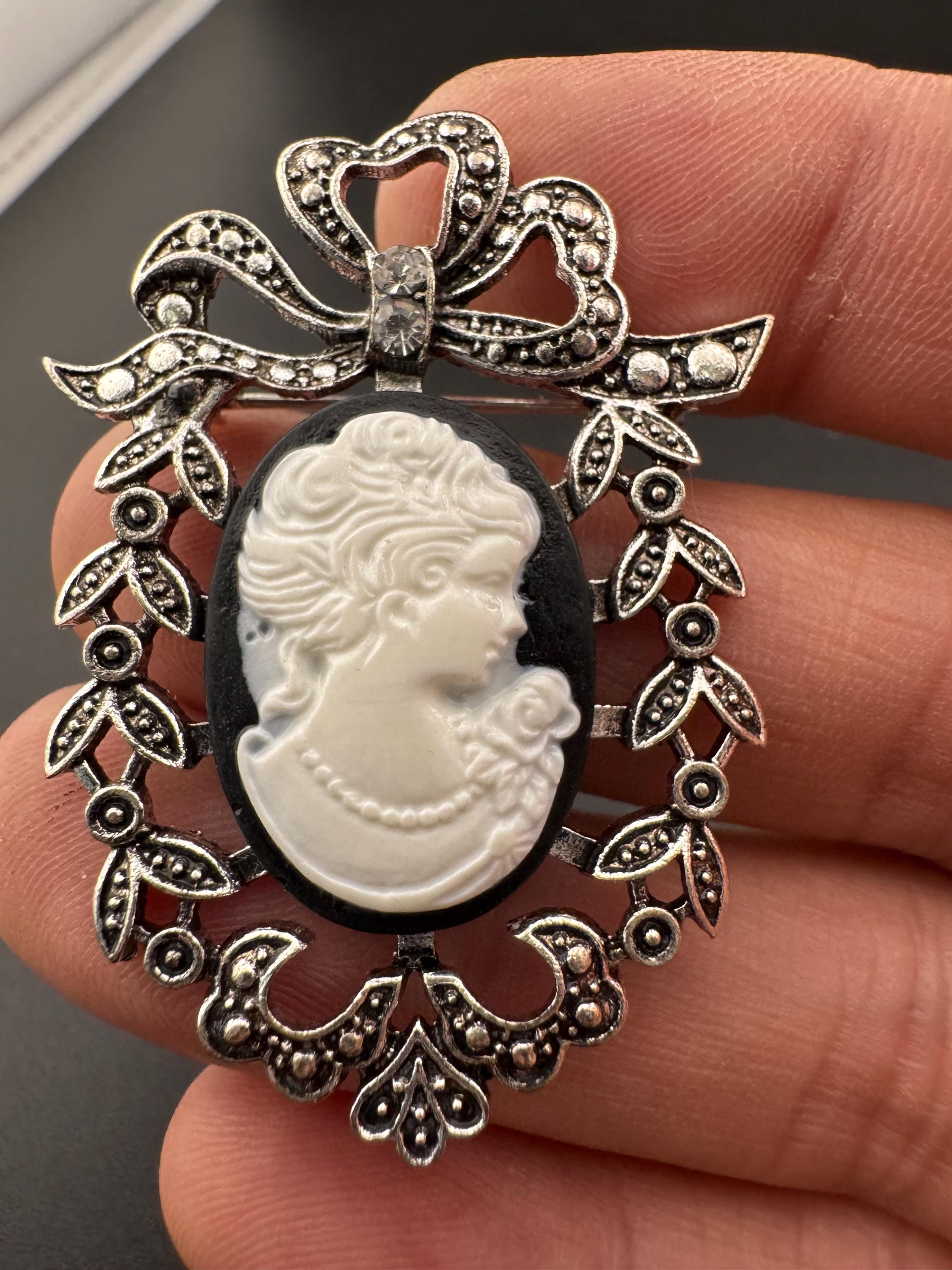 Vintage style handmade black and white cameo brooch with antique silver tone ornate frame