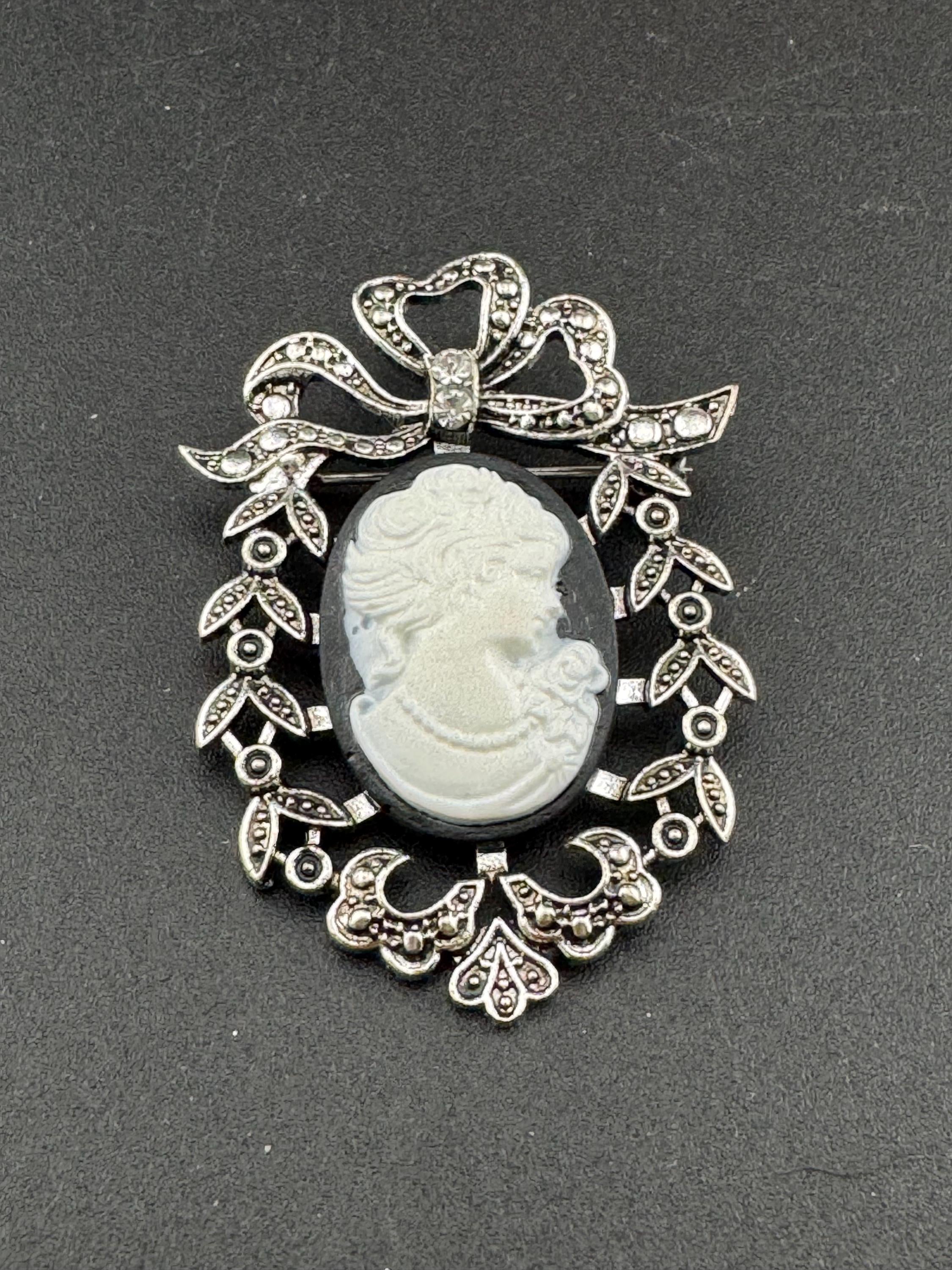 Vintage style handmade black and white cameo brooch with antique silver tone ornate frame