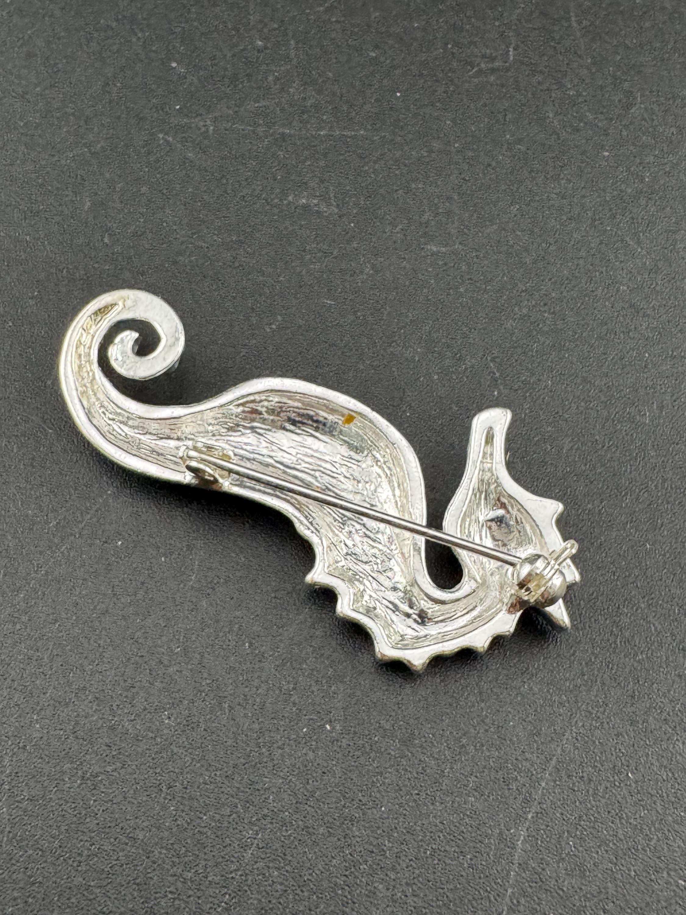 Vintage silver metal seahorse brooch with turquoise blue diamanté eye, nautical marine style